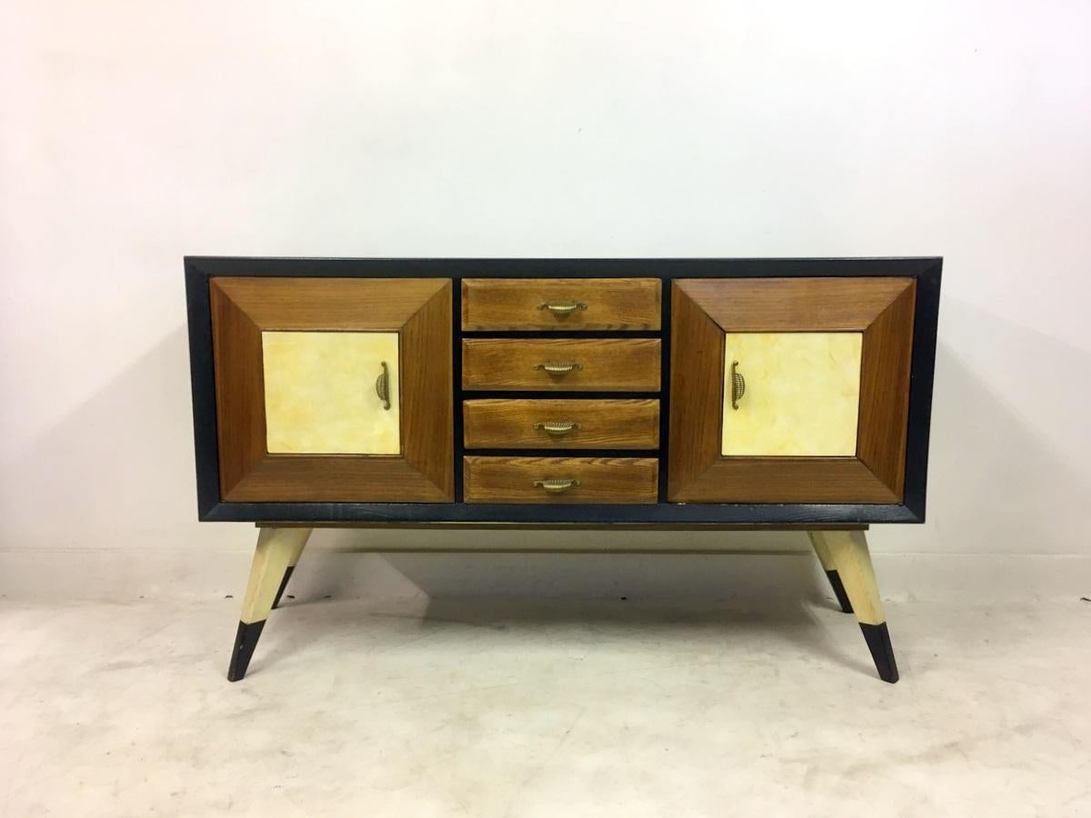 Ebonised and oak sideboard

Parchment door panels

Two cupboards

Four drawers

Brass handles

Italy, 1940s.