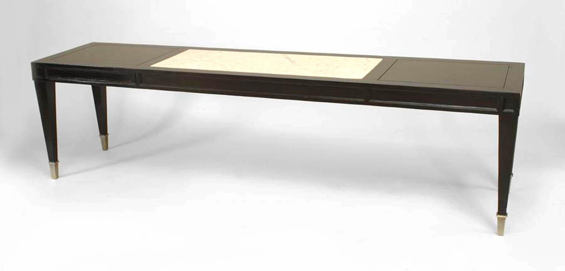 Italian Mid-Century (1940s) ebonized narrow rectangular coffee table with inset white Carrara marble middle section with silver-plated sabot feet.
