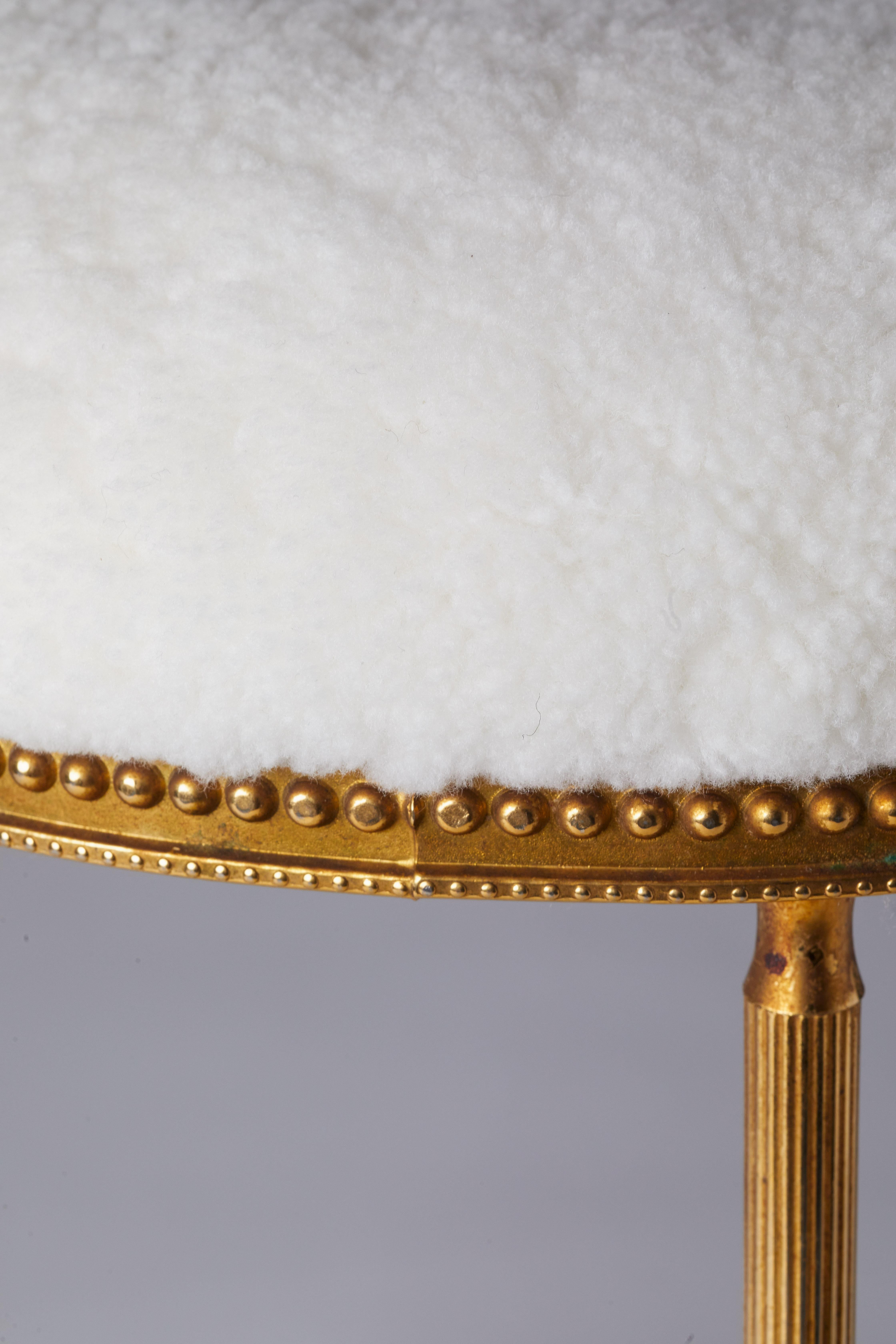 1940s Italian circular gold gilded poof with white curly shearling on seat. Fully reupholstered and restored.