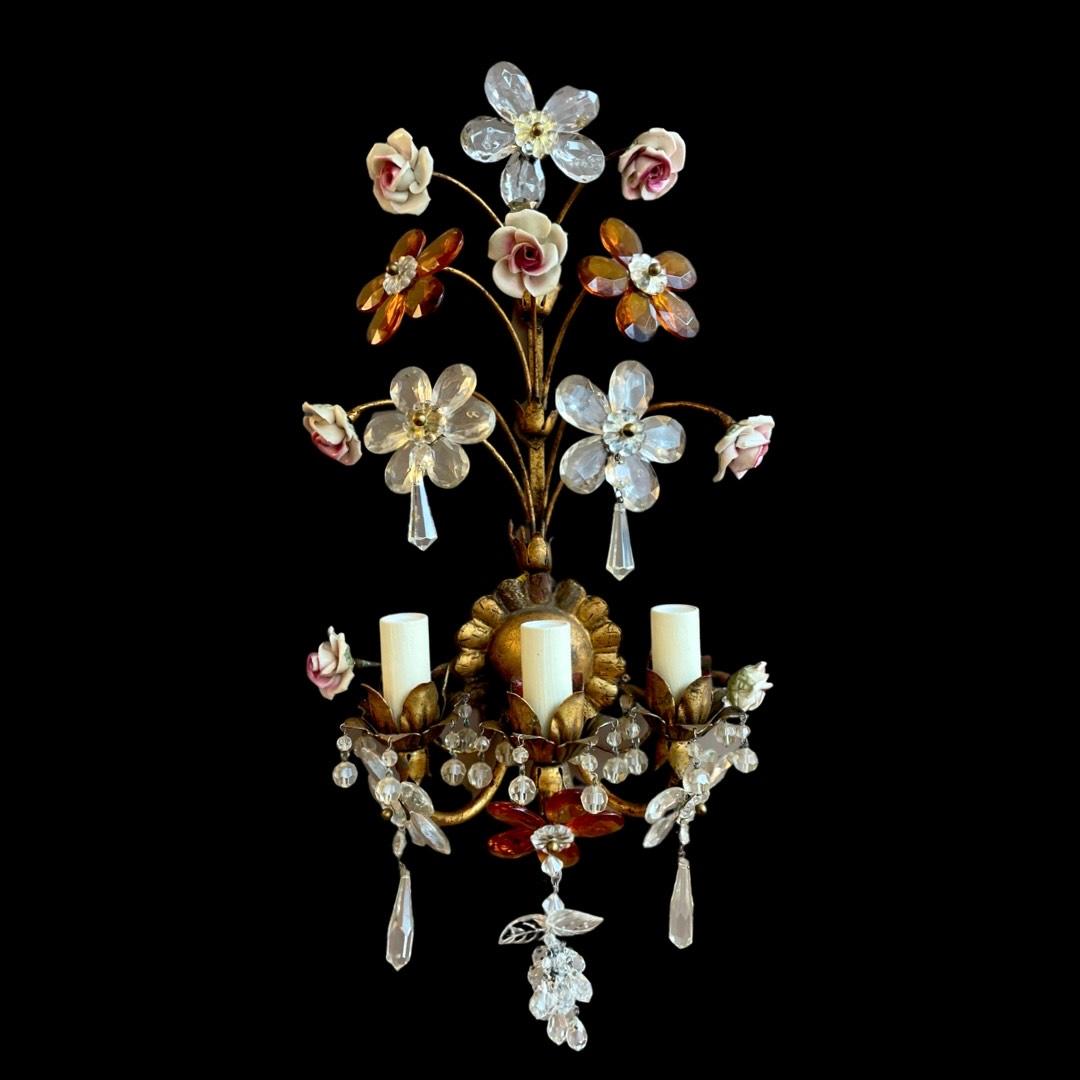 Behold the exquisite allure of these captivating gilt bronze 1940's floral wall lights, a mesmerizing testament to vintage craftsmanship and timeless elegance. Each piece boasts three splendid light fittings, casting a warm and enchanting glow that