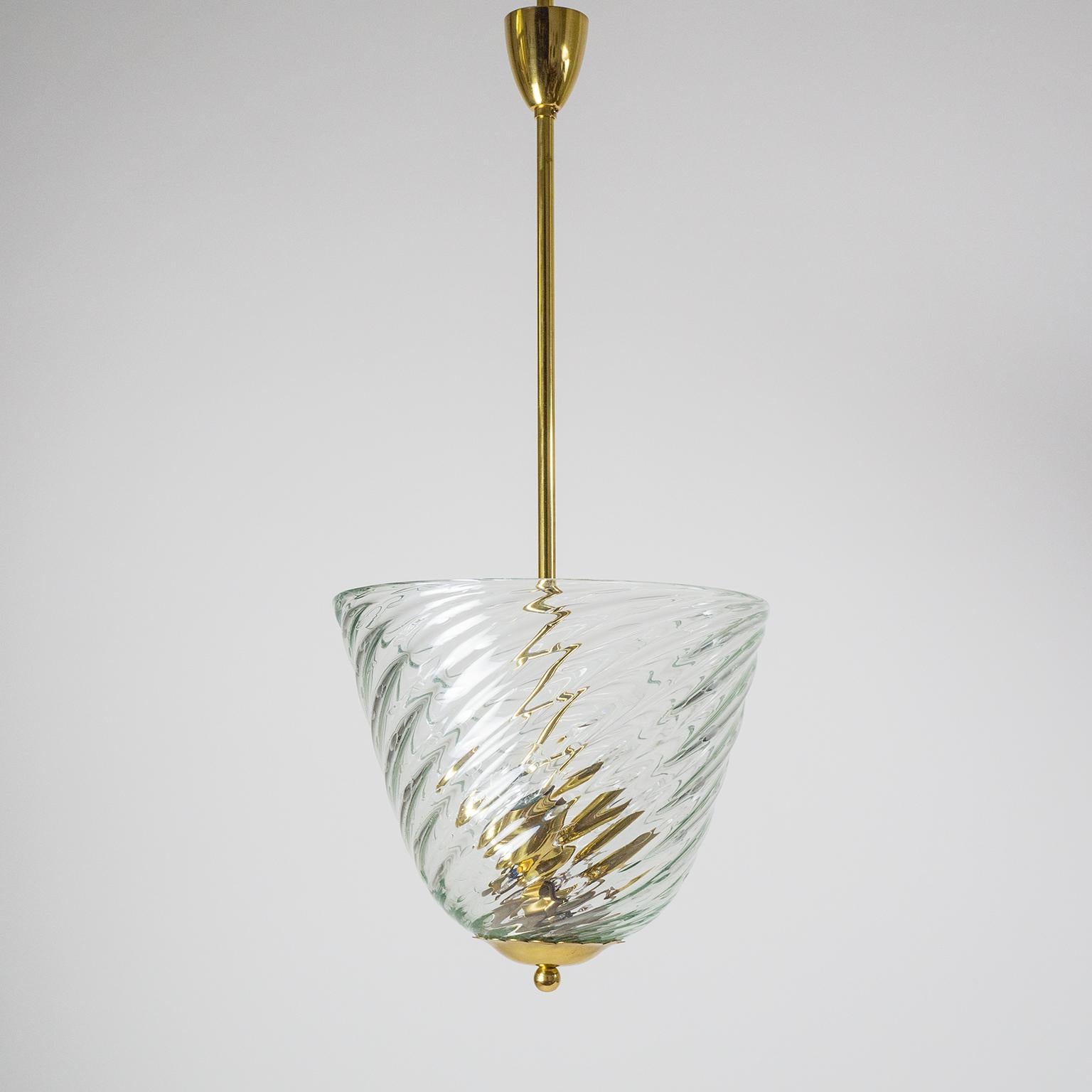 Impressive Murano glass basket chandelier attributed to Barovier & Toso. Solid brass hardware with a large hand blown swirling glass basket in bullicante technique (denotes a regular pattern of enclosed air bubbles). Three original brass E27 sockets