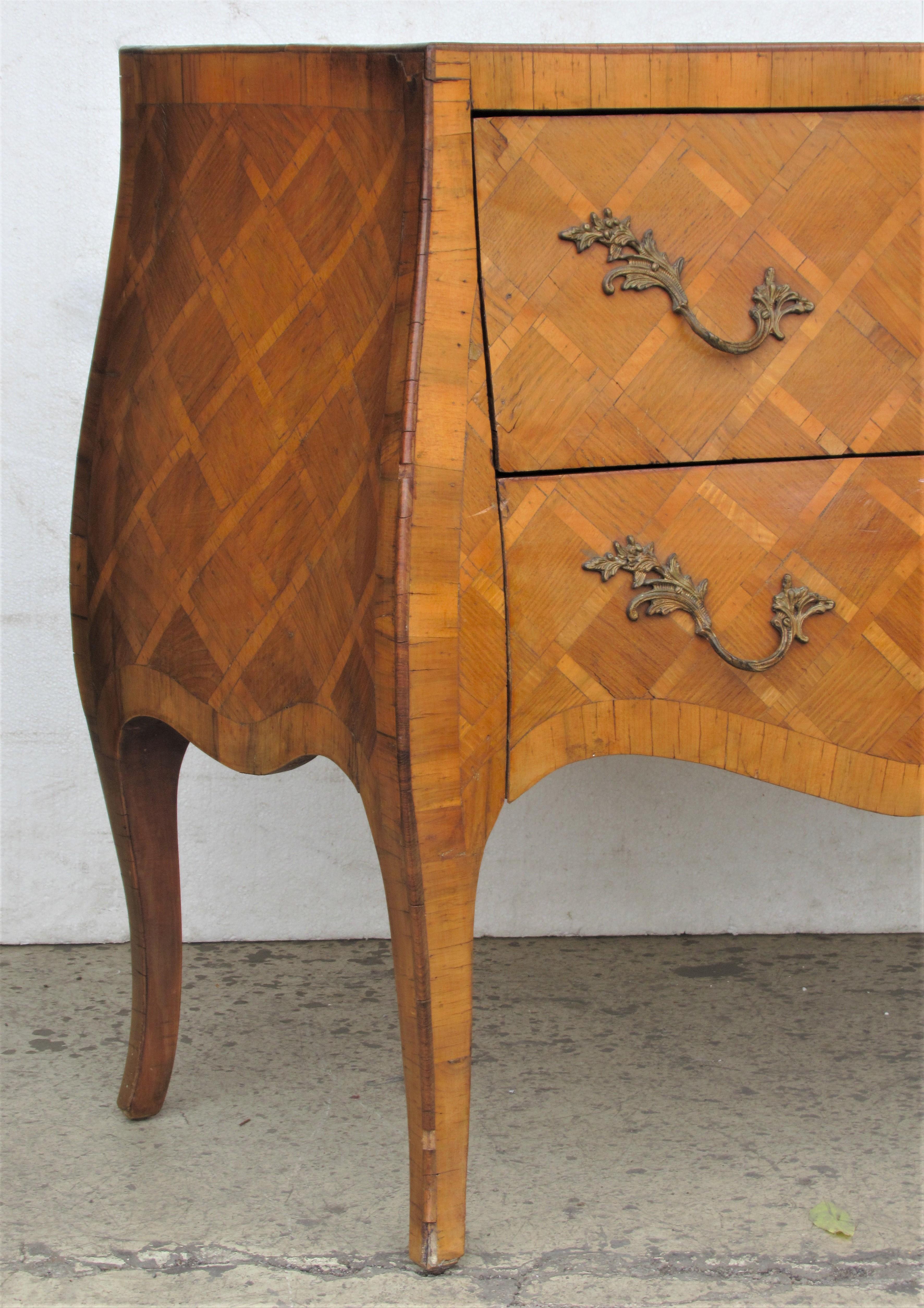 Olive wood burl veneer parquetry inlaid two-drawer 18th century style Bombay form commode with nicely detailed raised leaf design brass hardware and overall beautifully aged original old surface. Made in Italy - circa 1940s. Look at all pictures and