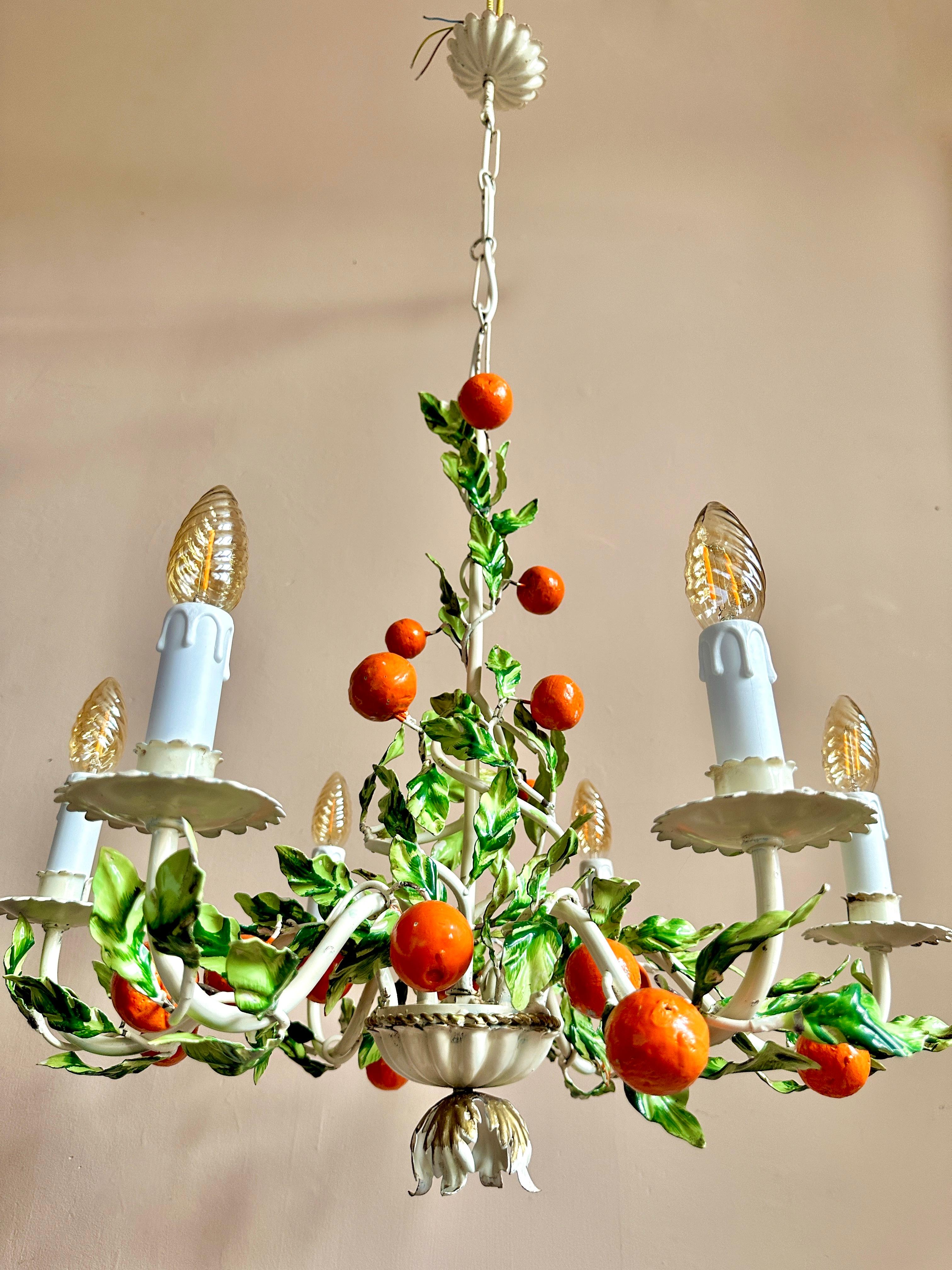 1940s Italian orange toleware chandelier.

Superb and rare Florentine hand-painted, six-arm ceiling light. In excellent condition with very light and attractive wear. The chandelier has been rewired, fitted with new bulb holders & sleeves and PAT