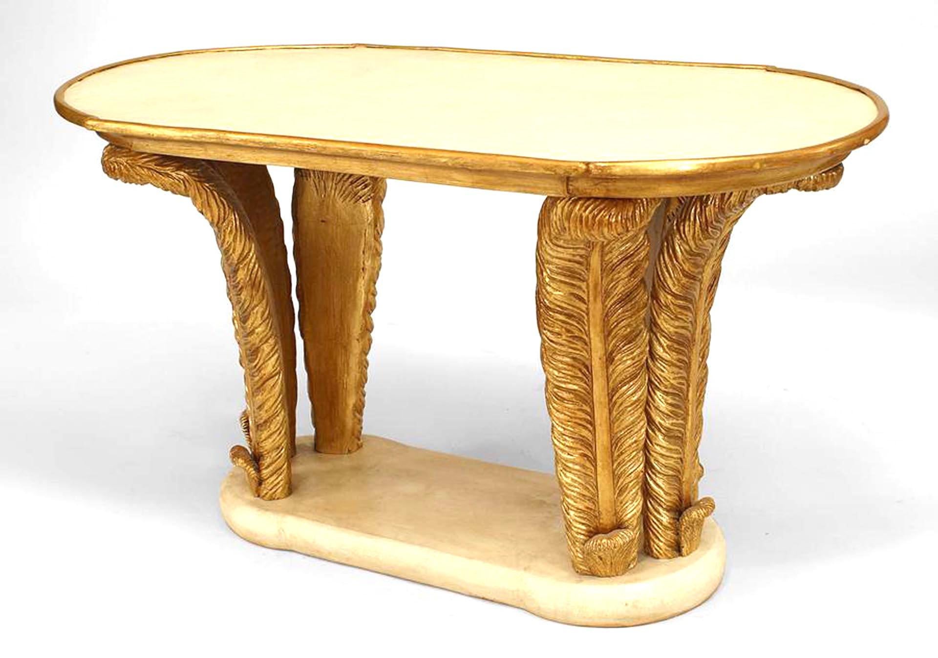 Italian Mid-Century (1940s) oval coffee table with a parchment top and platform base supported by two Pairs of gilt carved feathers.
