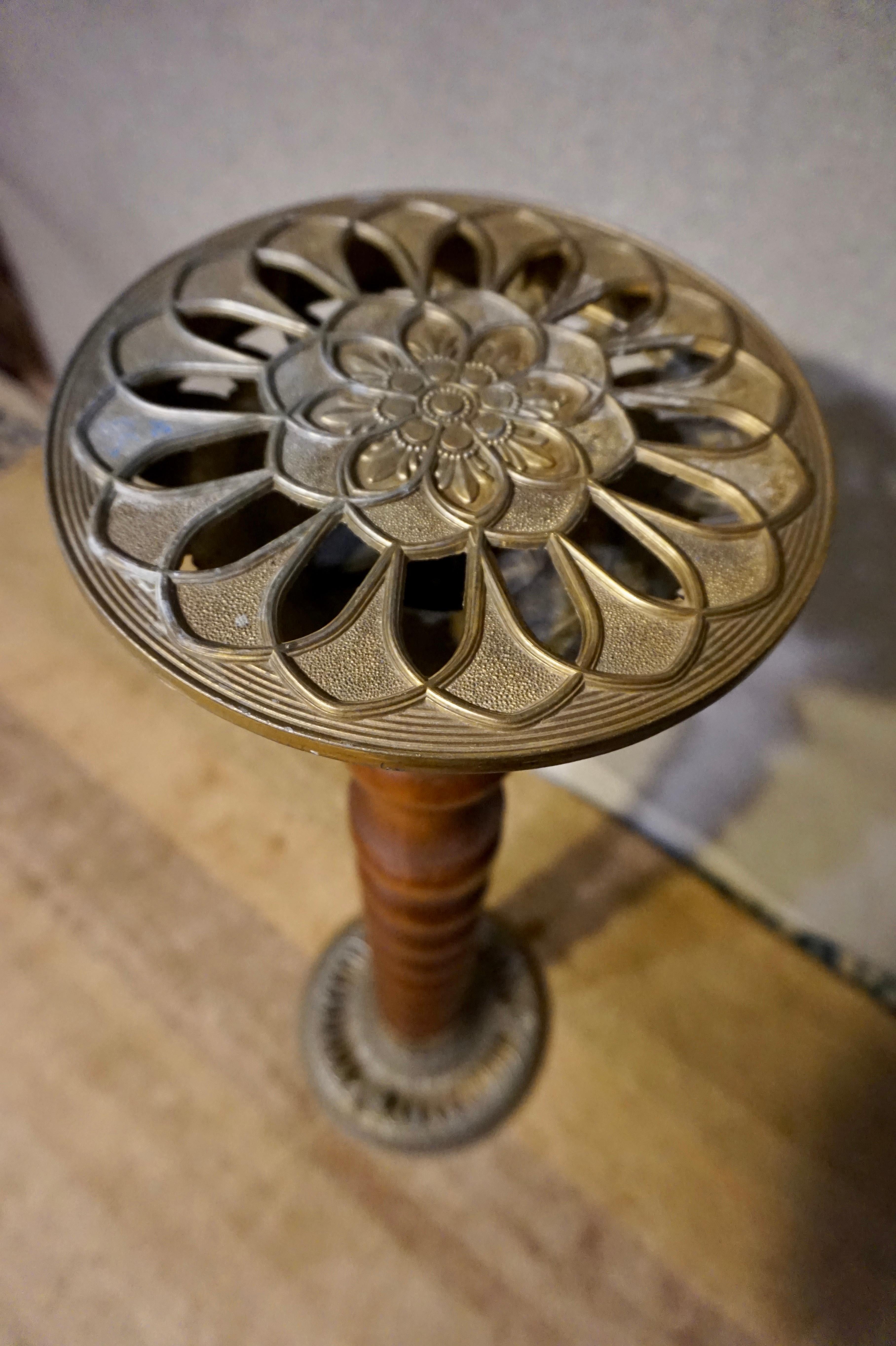 circa 1940s

Revivalist plant stand with elegant proportions and construction from oak and brass.