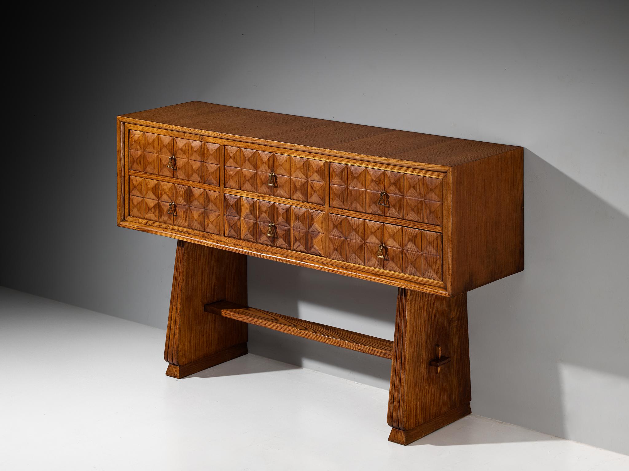 Sideboard, chestnut, brass, Italy, 1940s 

A truly remarkable piece of furniture that excels in every aspect of design: from its impeccable execution and charmingly crafted carvings to its craftsmanship and meticulous attention to detail. The