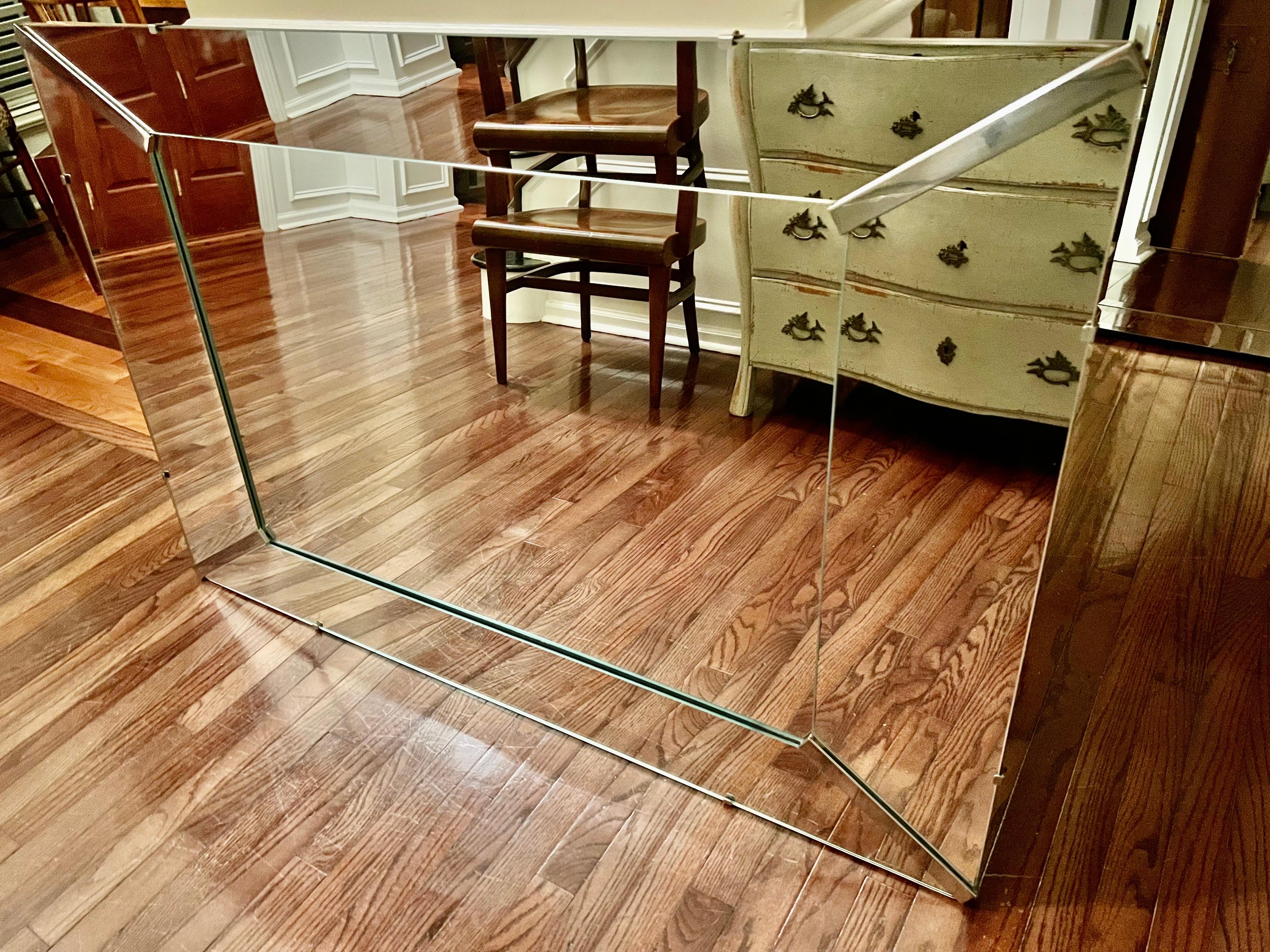 Large, elegant Hollywood Regency Venetian style mirror with a layered simple frame, circa 1940's. The corner pieces add dimension and depth to the beautiful design. A stunning mirror to coordinate with many styles.
