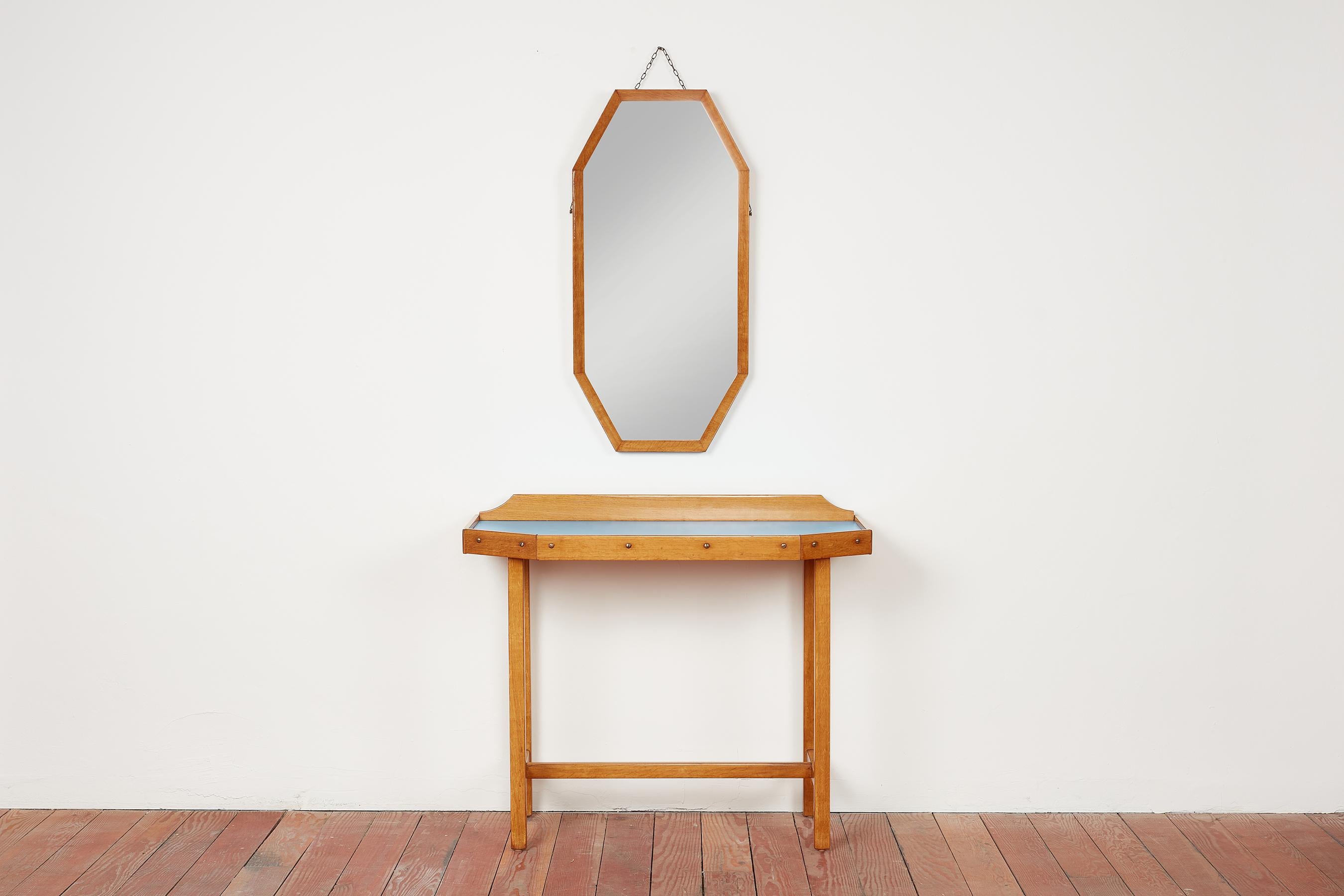 1940's Italian vanity console with matching mirror.
Lacquered maple wood with blue laminate top.
Great angular shape with matching mirror.
Brass hardware.
Console does not have drawers.

Mirror - 18