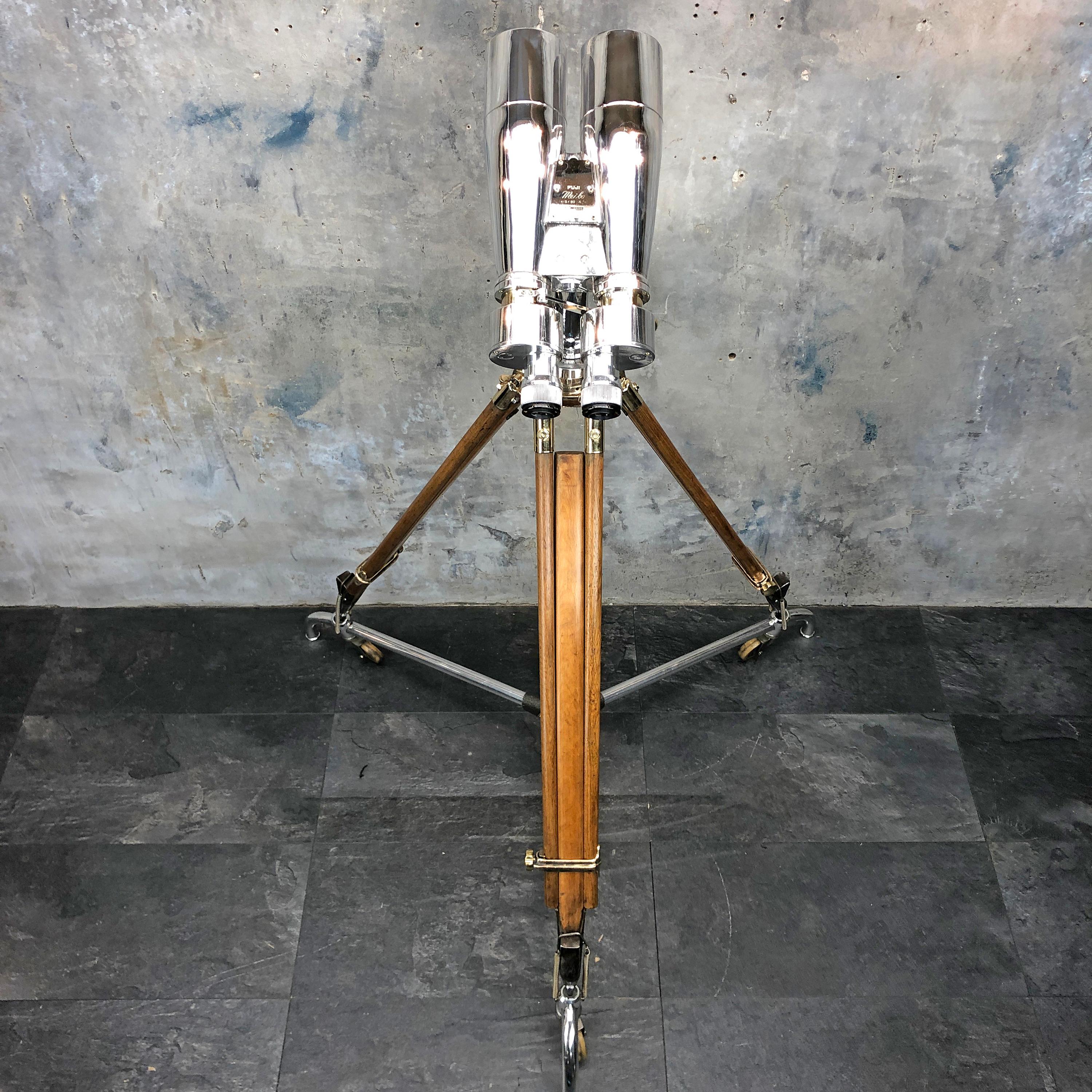 Japanese Fuji Meibo Observation Binoculars 15 x 80 - 4 degree field of view.

A large pair of Japanese ex-navy observation binoculars mounted on an antique 1940's bronze, brass and hardwood tripod. We have also included a tripod dolly which allow