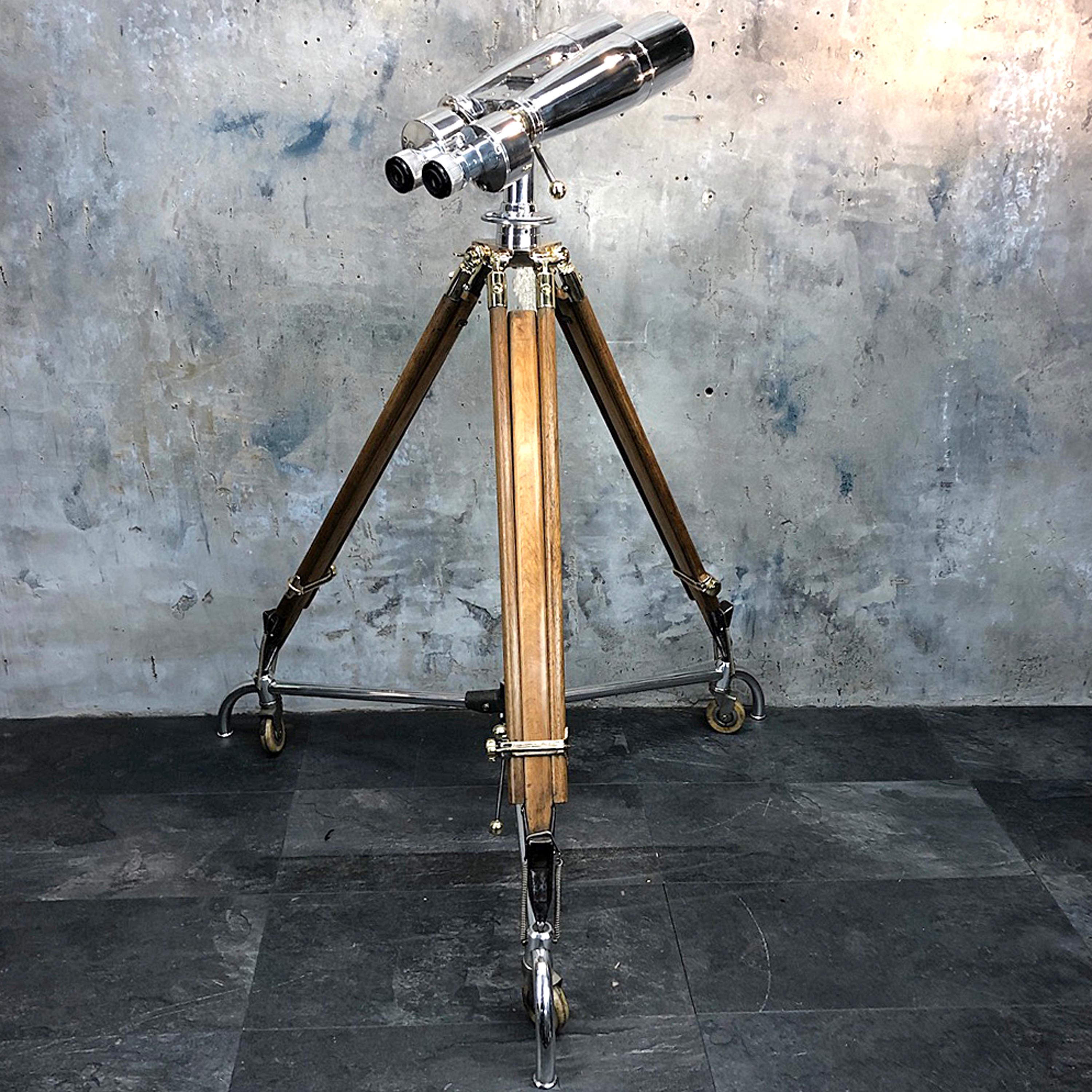 Japanese Fuji Meibo observation binoculars 15 x 80, 4 degree field of view.

A large pair of Japanese ex-navy observation binoculars mounted on an antique 1940s ERYL & S bronze, brass and hardwood tripod signed and stamped with the British Ministry