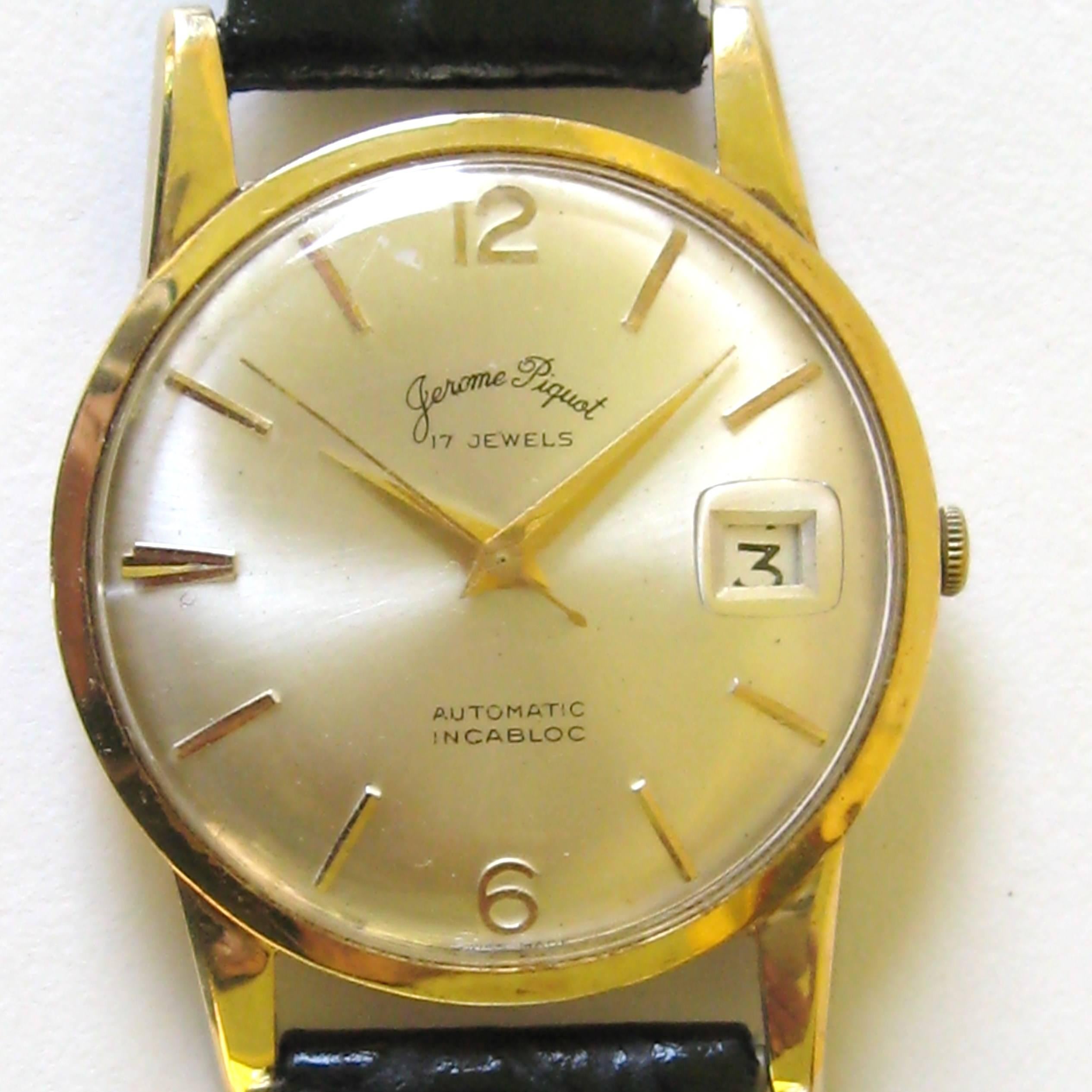 Jerome Piquot 14k yellow gold wristwatch with date and sweep center seconds, 17 jewels automatic movement with Incabloc. Leather band. Watch is approximately 1.39 inches in circumference. Watch is in working condition. Please check our storefront