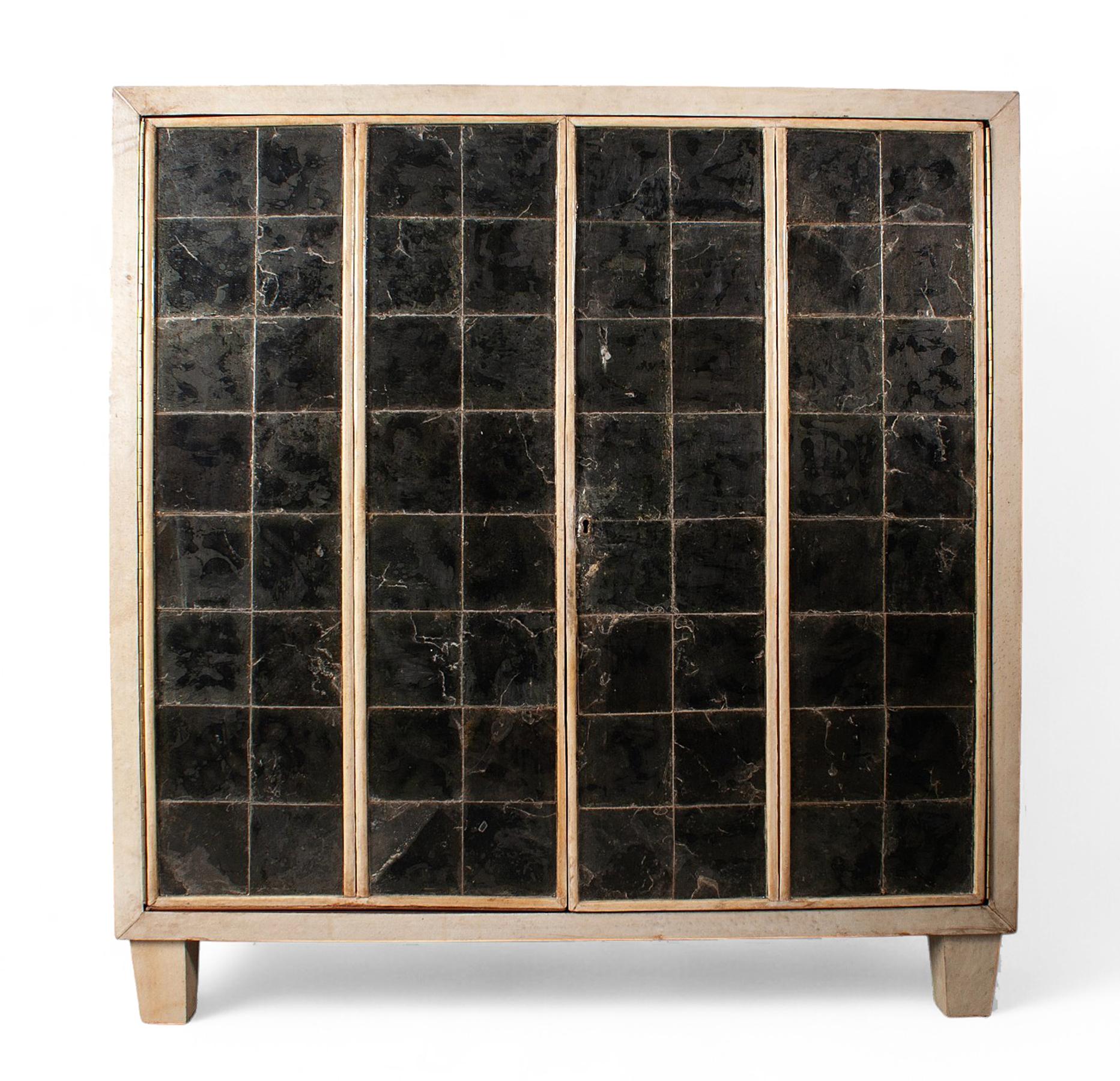 1940s Mid-Century Modern Jen-Michel Frank-style parchment-covered wood cabinet by Comte S.A., Argentina

By: Comte S.A., Jean-Michel Frank (in the style of)
Material: wood, parchment paper
Technique: carved, varnished
Dimensions: 16 in x 39.5 in x