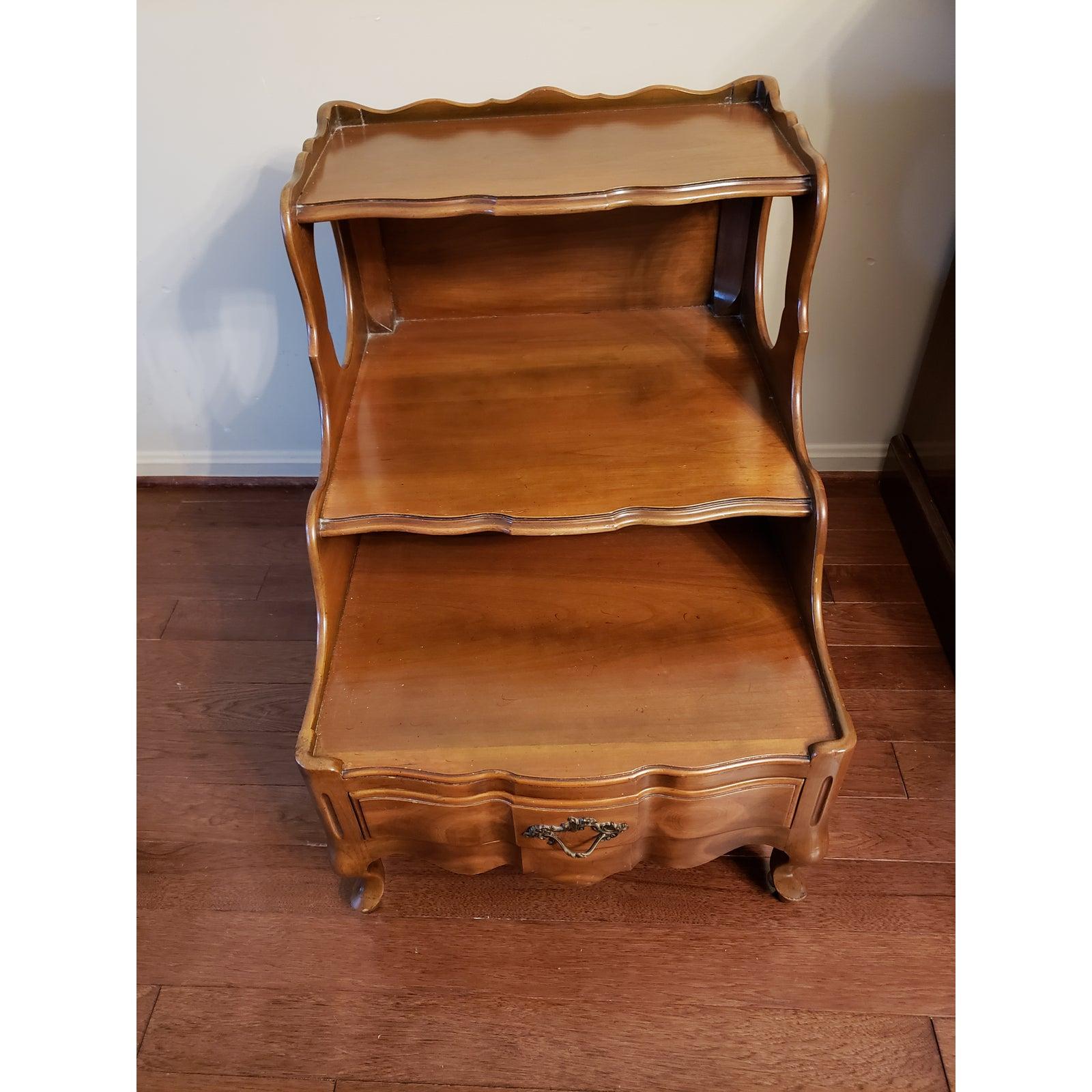 Rare find. John Widdicomb three tier walnut end Table with a bottom drawer. Made in the 1940s.