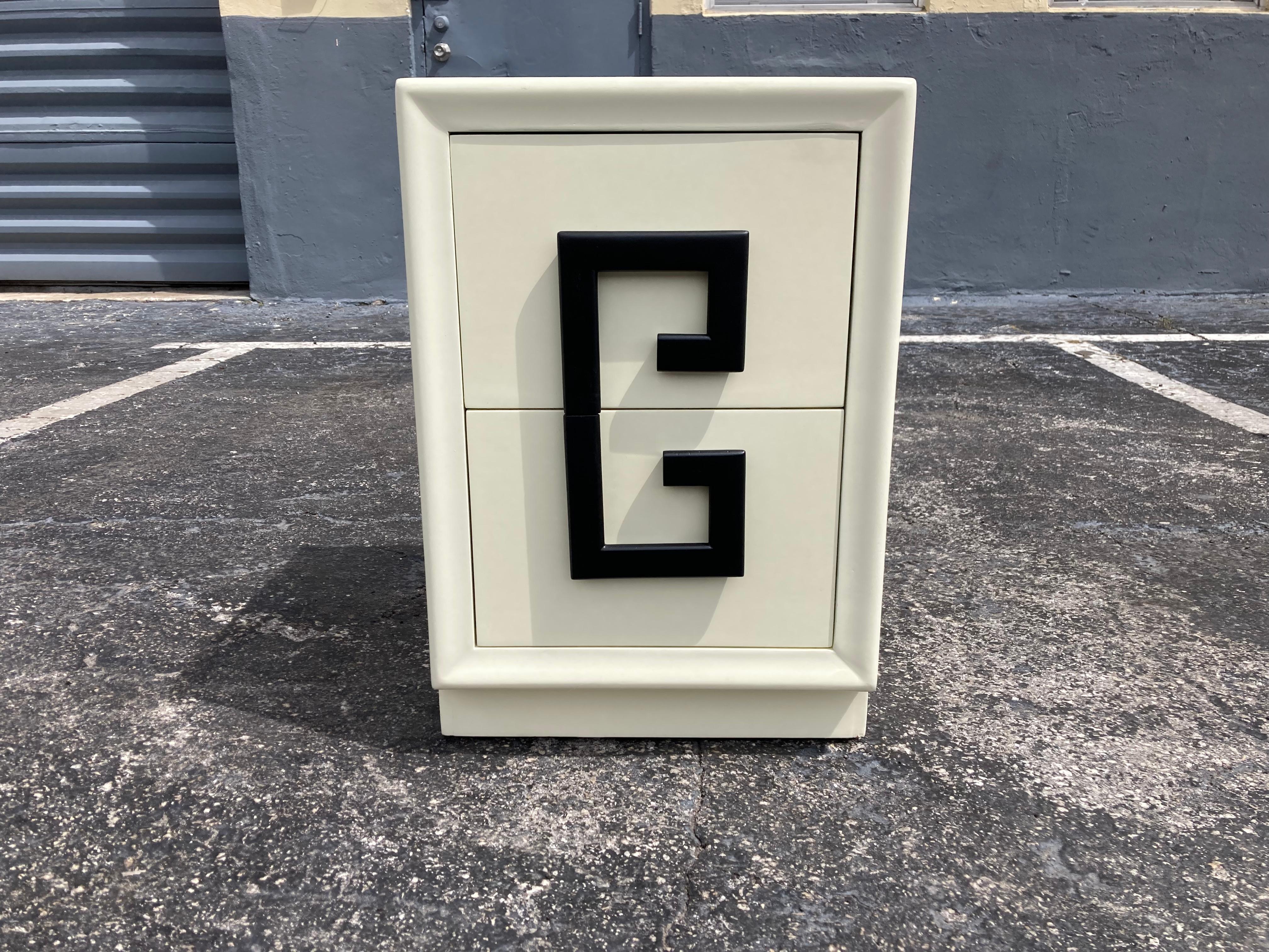 Kittinger Mandarin Greek Key Nightstand, cream color lacquer and black pulls. Ready for a new home. Nightstand is not signed. Matching Dresser available.