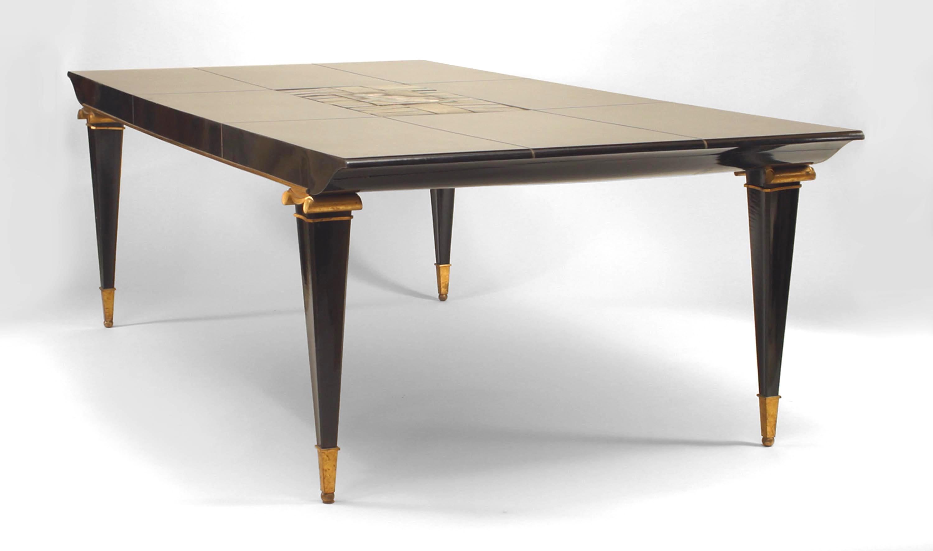 French Mid-Century (1940s) ormolu mounted ebonized dining table with rectangular top inlaid with center glazed tiles depicting figures and horses. (Attributed to PIERRE LARDIN; tiles attributed to JEAN MAYODON)
