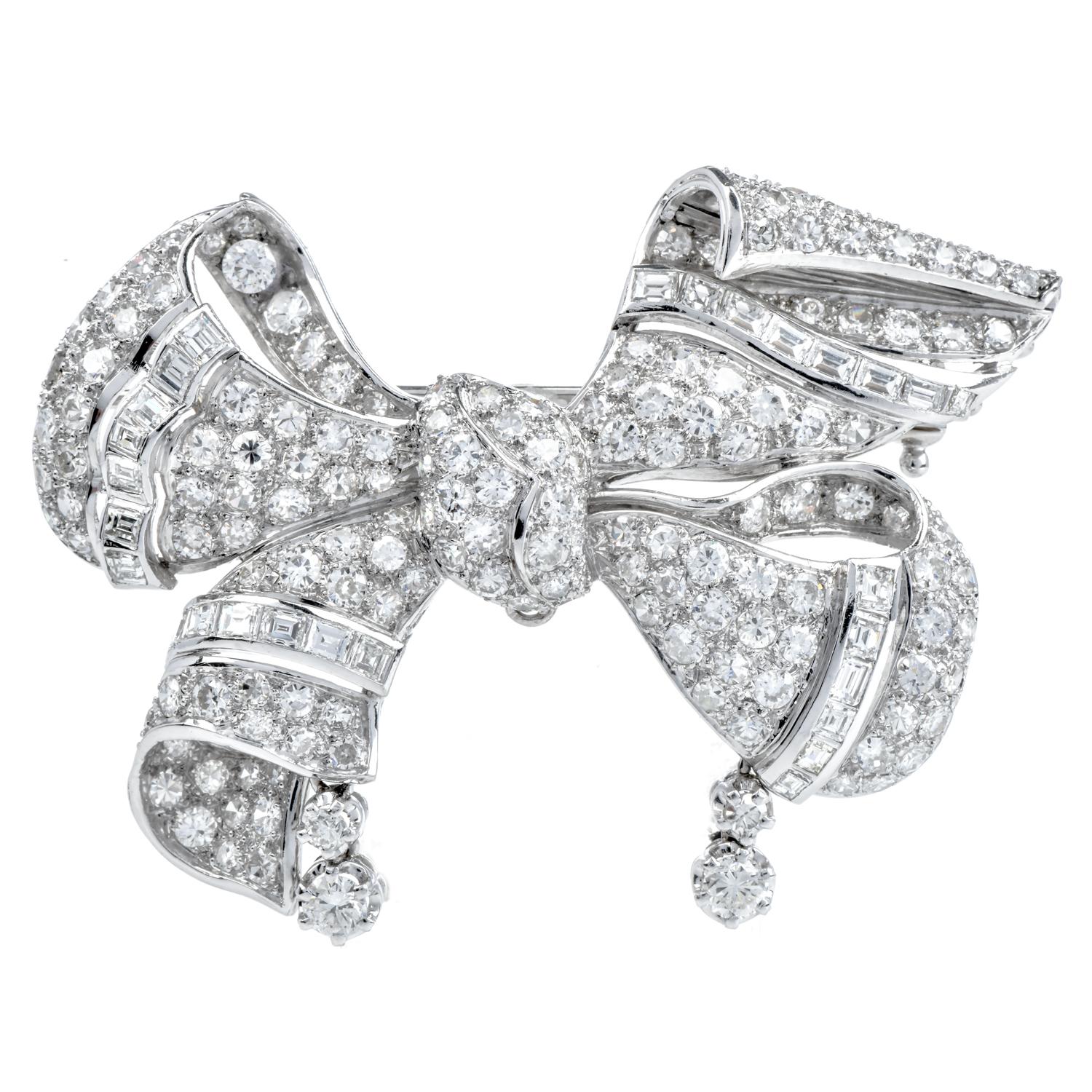 Dazzle yourself with this vintage Diamond Sapphire Platinum Bow Pin Brooch & Pendant.

 This large Diamond piece with an approximate total weight of 33.8 grams.

Exquisitely crafted in solid platinum,  it features 153 pave set round-cut genuine