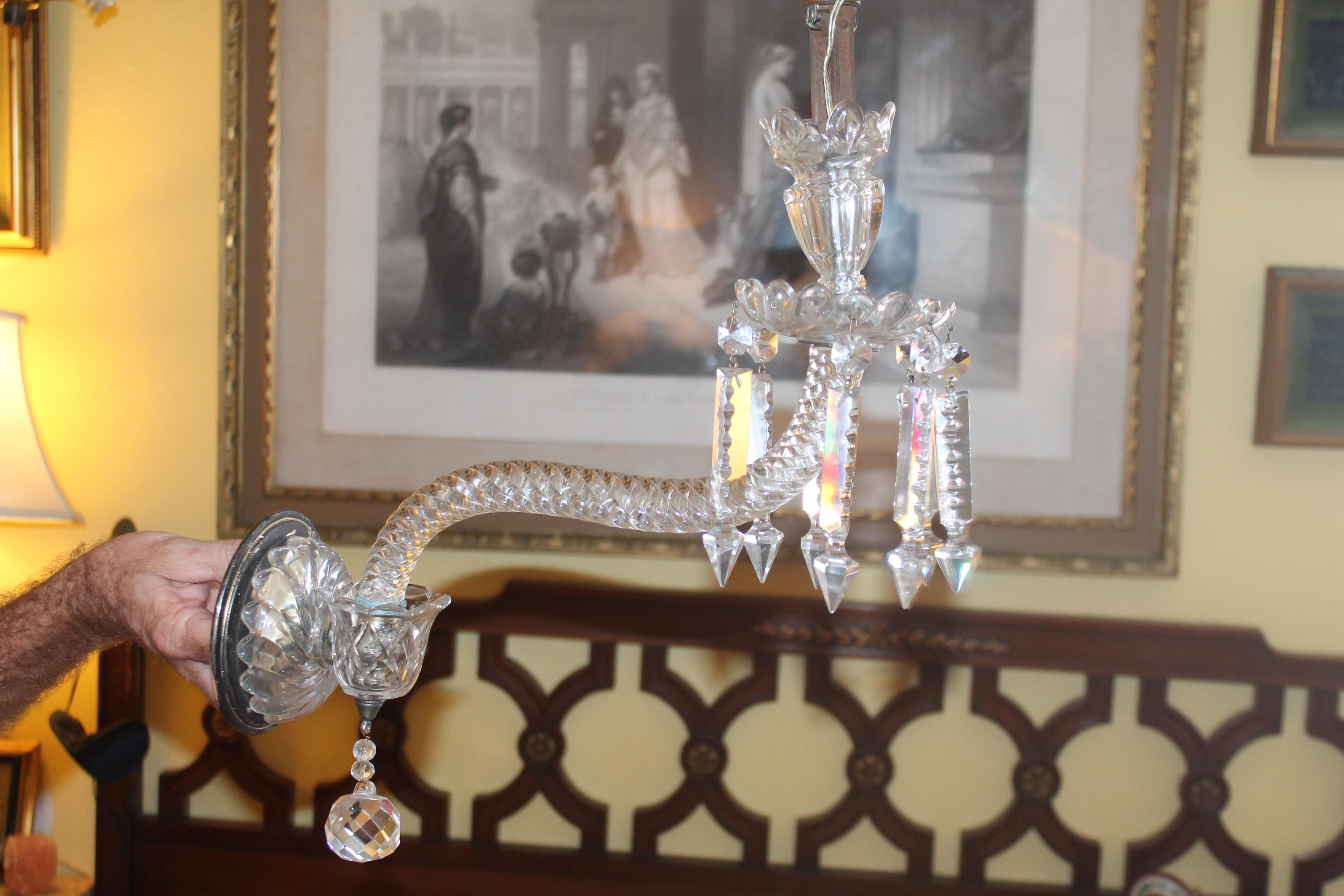 1940's French Hollywood Regency Cut Crystal Swirl Pattern Wall Sconce. Large impressive sconces in the style of Baccarat.