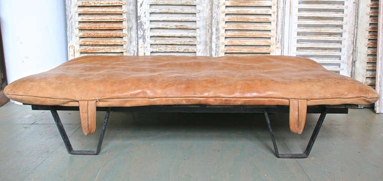 1940s French leather gym mat daybed on iron and wood skid base.



 