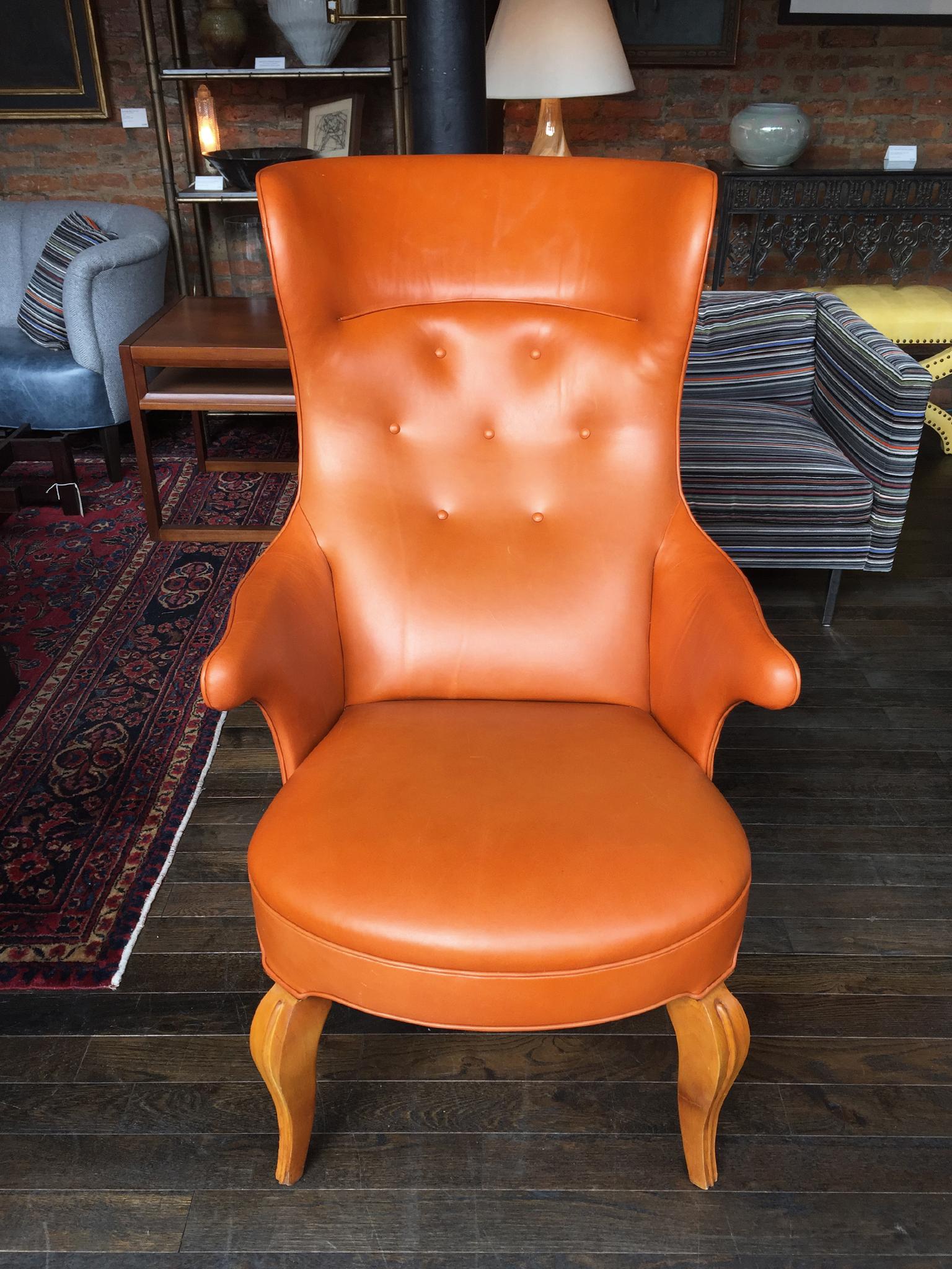 This exceptional high wingback armchair is attributed to Danish designer Frits Henningsen (1899-1965). Henningsen was renowned for the craftsmanship of his handmade furniture. He created the design for this chair in the 1930s. This particular chair