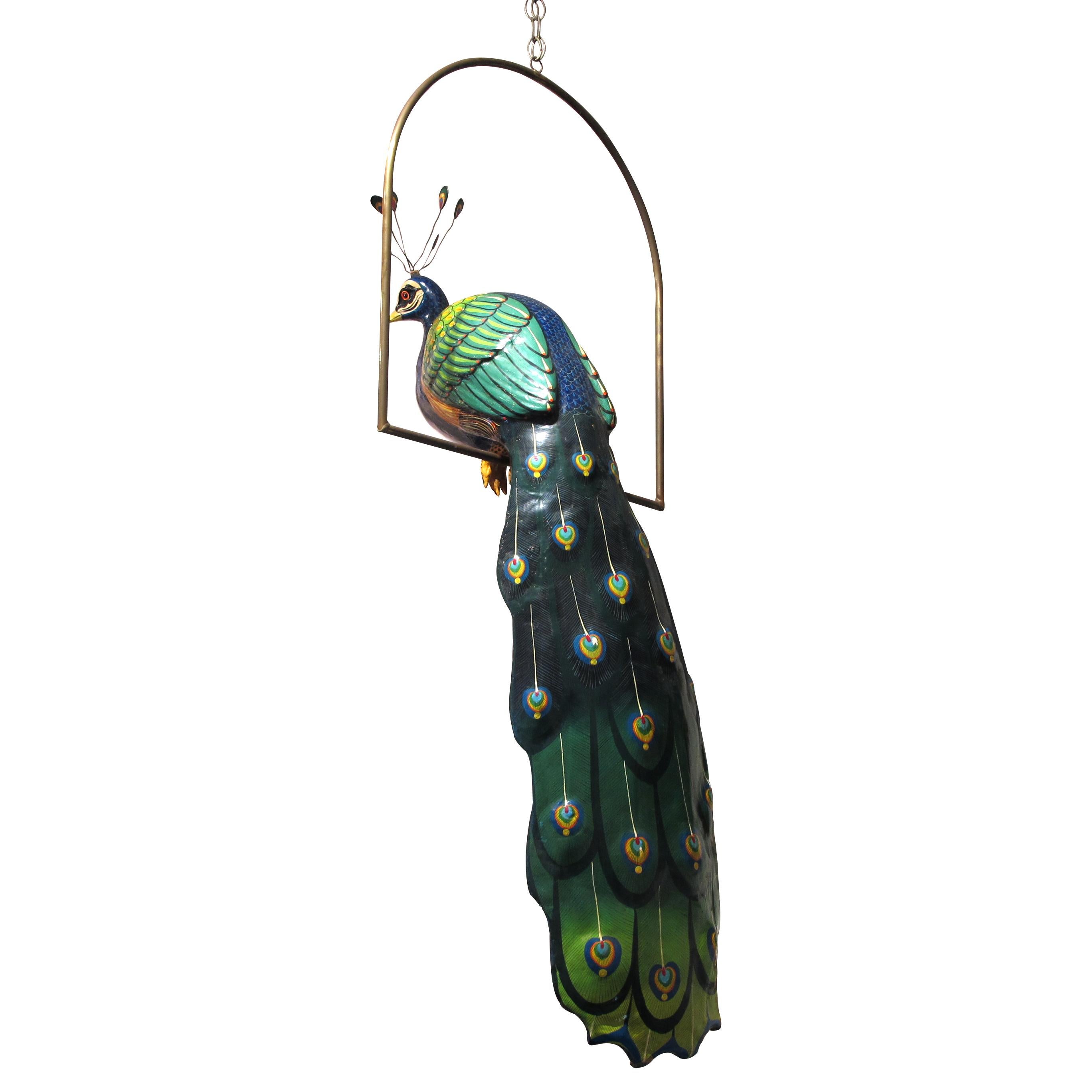 Beautiful life size papier maché sculpture of a peacock, perched on a brass frame, by Mexican artist Carlos Del Conde, who is known for his sculptures of papier maché colourful exotic birds. Carlos Del Conde also collaborated with the Mexican artist
