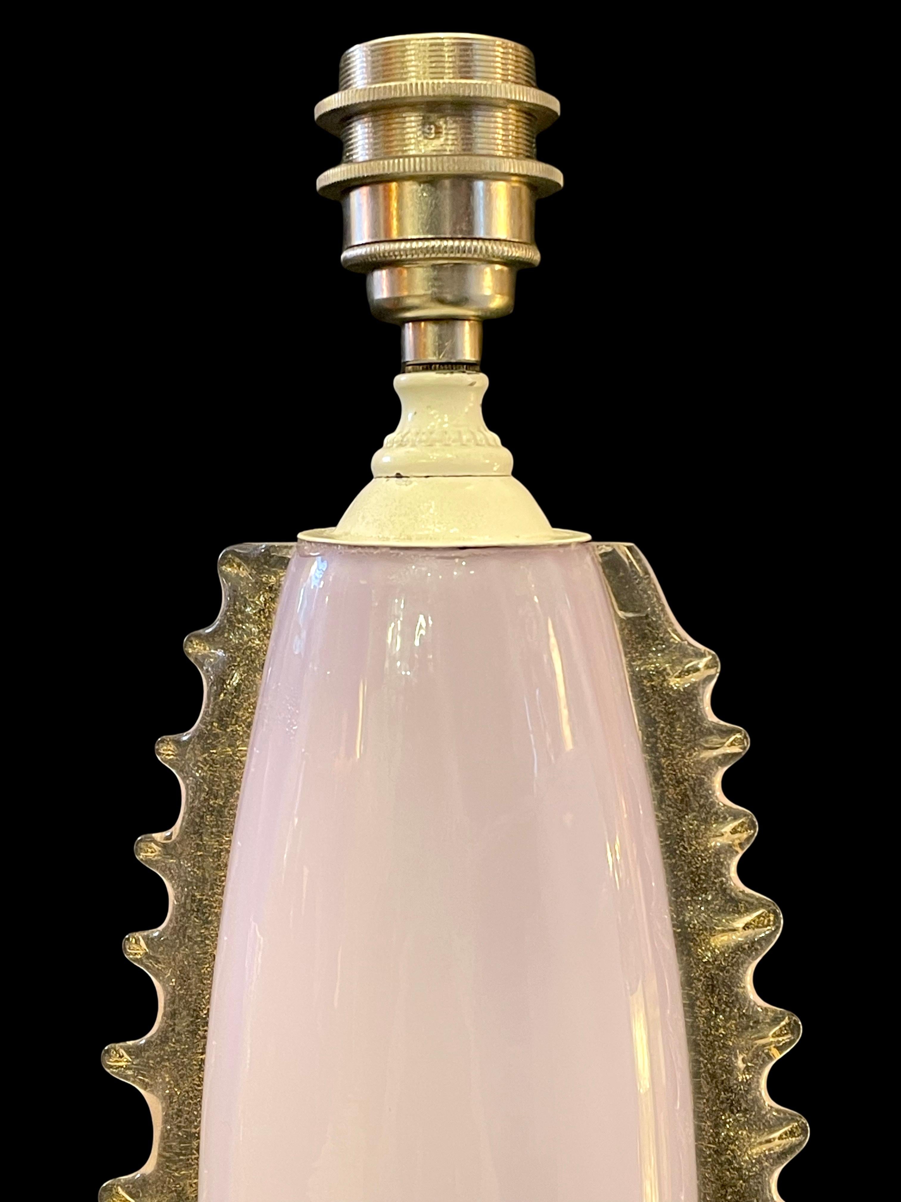 Add a touch of vintage charm to your space with this stunning 1940's Lilac Spike Murano Table Lamp!

Crafted from exquisite Murano glass, its soft lilac hue effortlessly complements a variety of interior styles, making it a versatile statement
