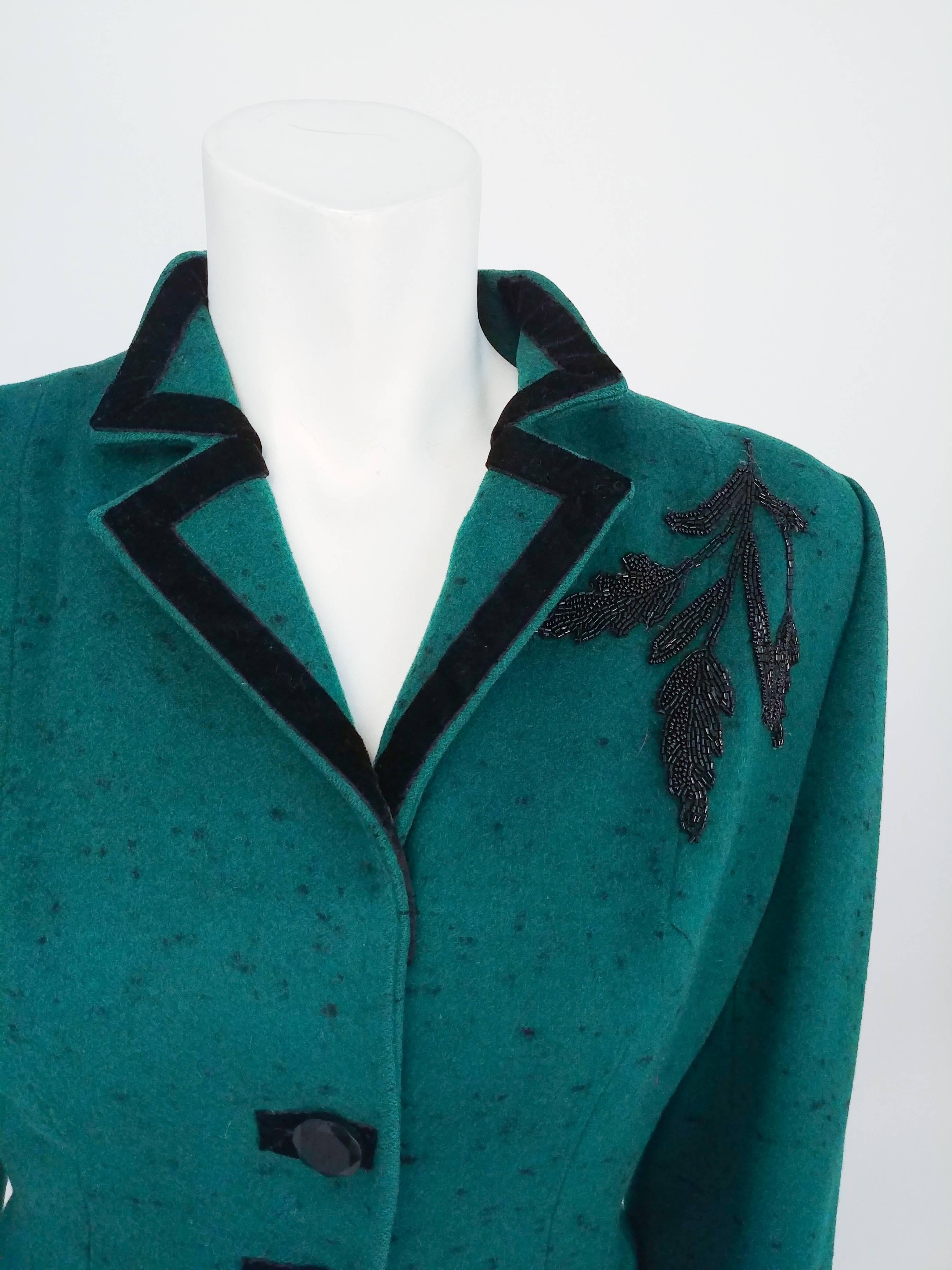 1940s Lilli Ann Speckled Green Suit Set. Black velvet trim and beaded applique on one shoulder. Flared peplum on jacket. 