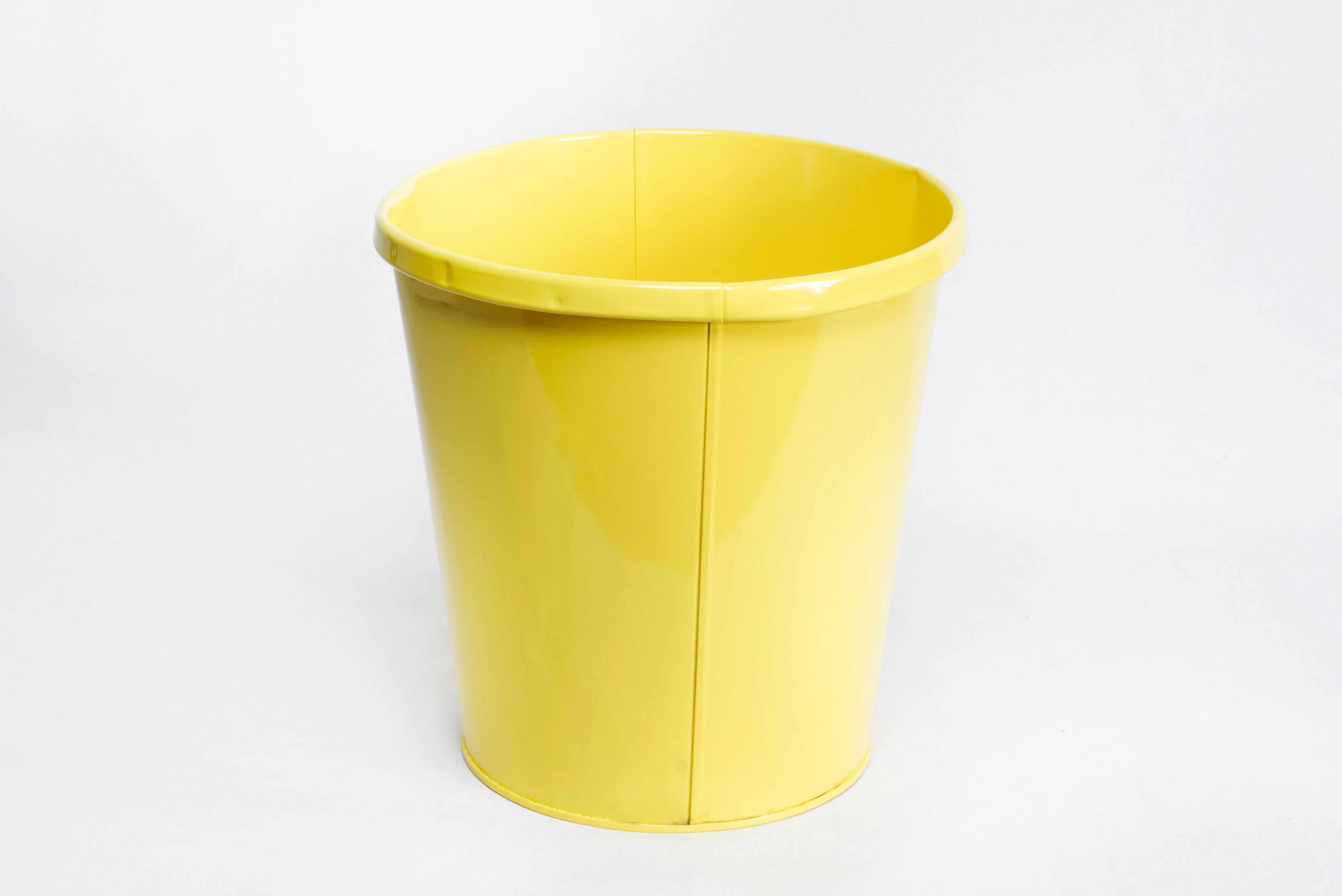 Excellent 1940s steel trash can refinished with a gloss sunshine yellow powder coat. Stamped: LIT-NING PRODUCTS CO, MADE IN USA. Tapered cylinder shape with folded rim. A cheerful addition to your office, bathroom or kitchen. Please note gentle