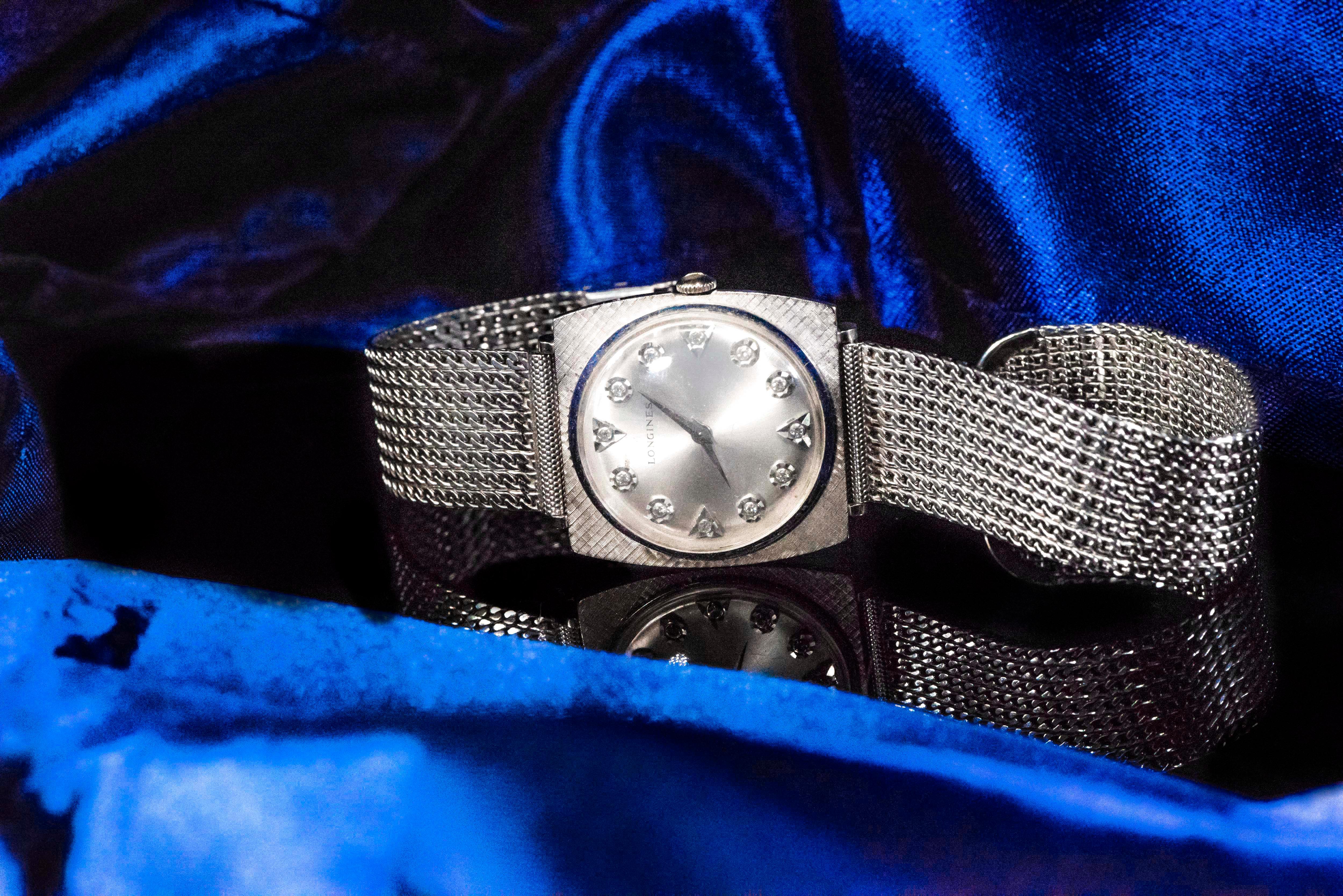 1940s Limited Edition White Gold  Longines Ultra Thin Diamond Set Dial with Satin Grey Finish & Iconic Adjustable Concept Bracelet Wristwatch 

Basic Specifications & Dimensions

Case Dimensions
- 35mm x 31mm 
- Bracelet has an adjustable bracelet
