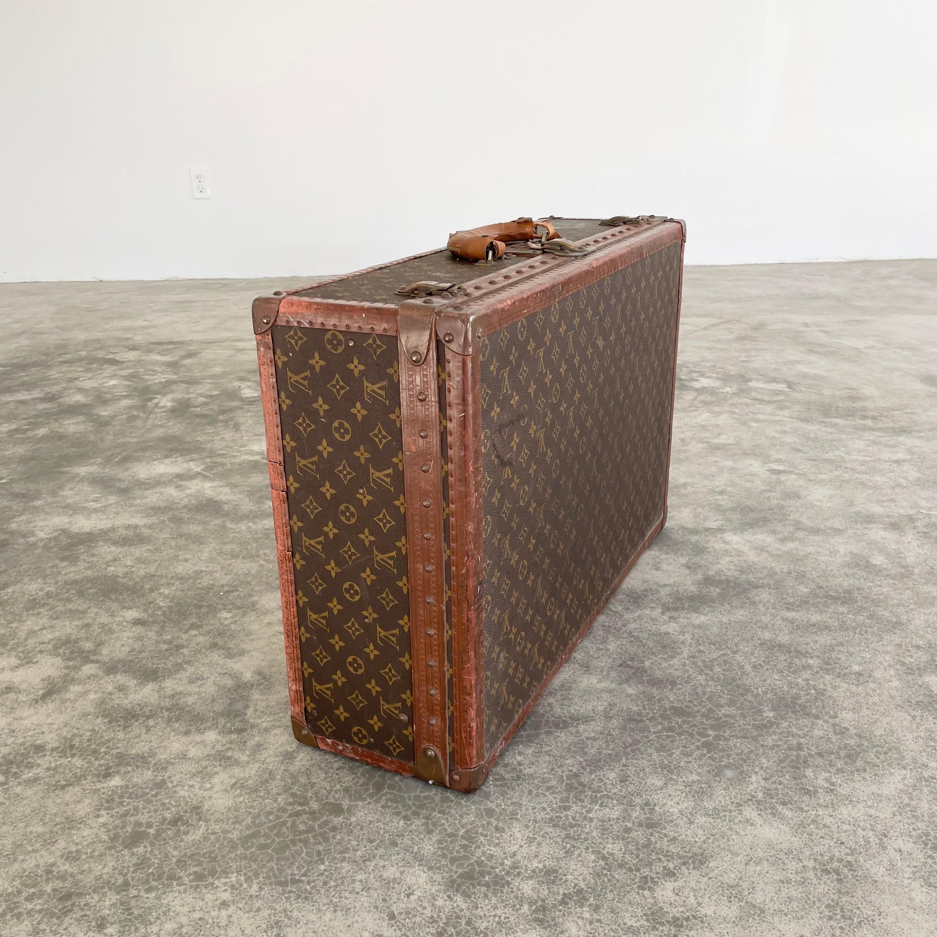Classic vintage Louis Vuitton trunk suitcase from 1948. Perfect for travel and weekend trips. This LV monogram print trunk is made with saddle leather and brass hardware and wrapped in the iconic Louis Vuitton canvas. Louis Vuitton was the first