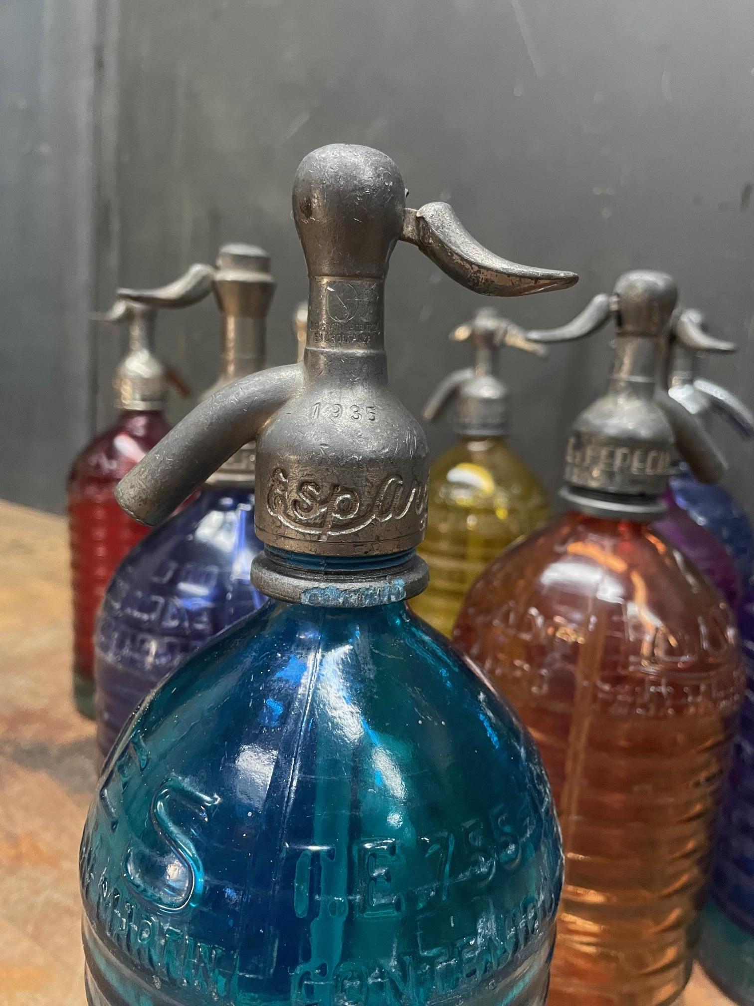 Molded 1940s Lourdes Siphon Seltzer Soda Bottle Collection Colorful Glass Vintage Decor For Sale