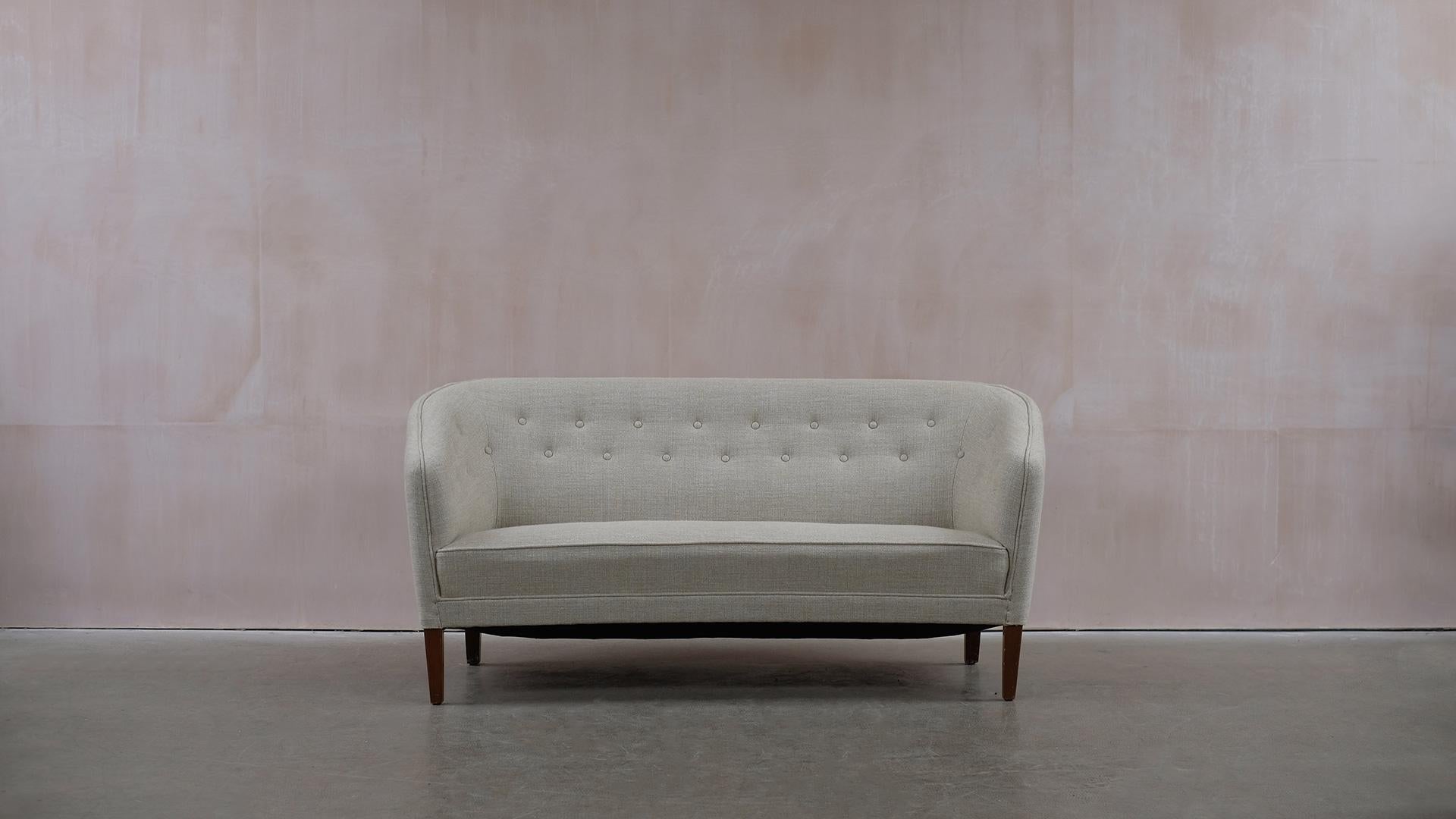 Wonderful sofa by Ludvig Pontoppidan, 1940’s Denmark. Refurbished and reupholstered in a beautiful linen fabric by Zinc. Ultra elegant and comfortable. A great sofa.   
