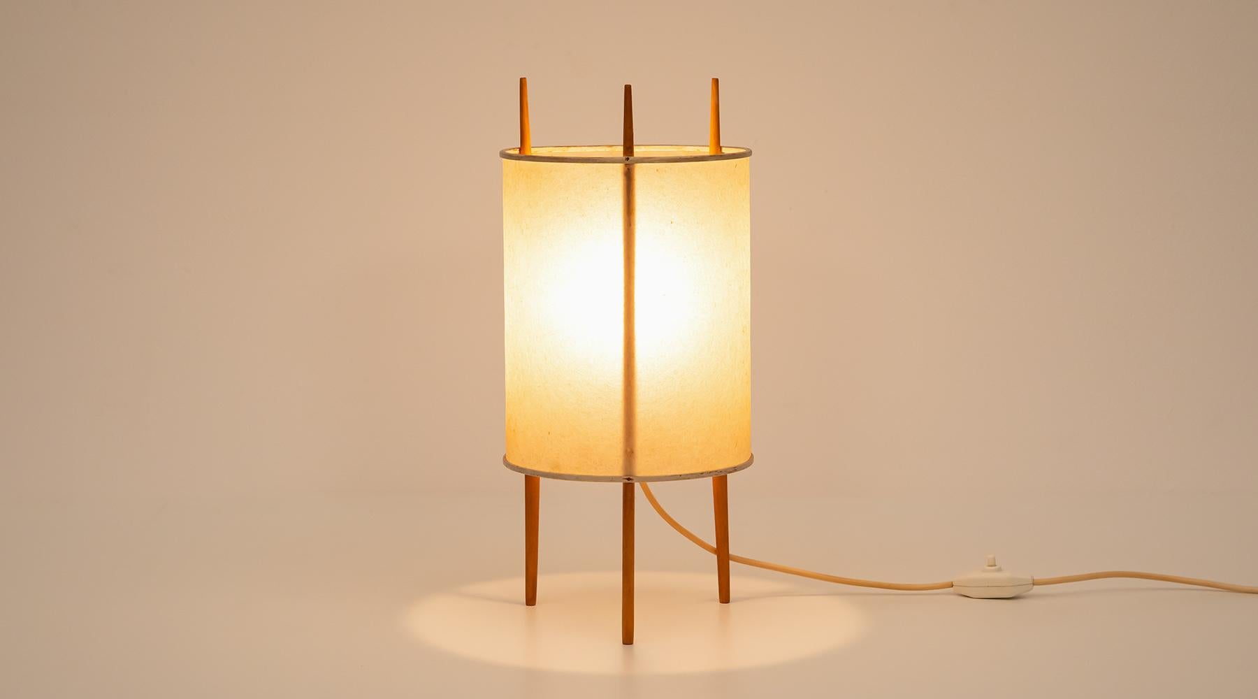 Three-leg table lamp, Isamu Noguchi for Knoll International, USA, 1947.

Three-legged Cylinder table lamp by Isamu Noguchi. The shade is made out of Fiberglas-reinforced polyvinyl and stands on three cherry sticks. The lamp promises a very warm,
