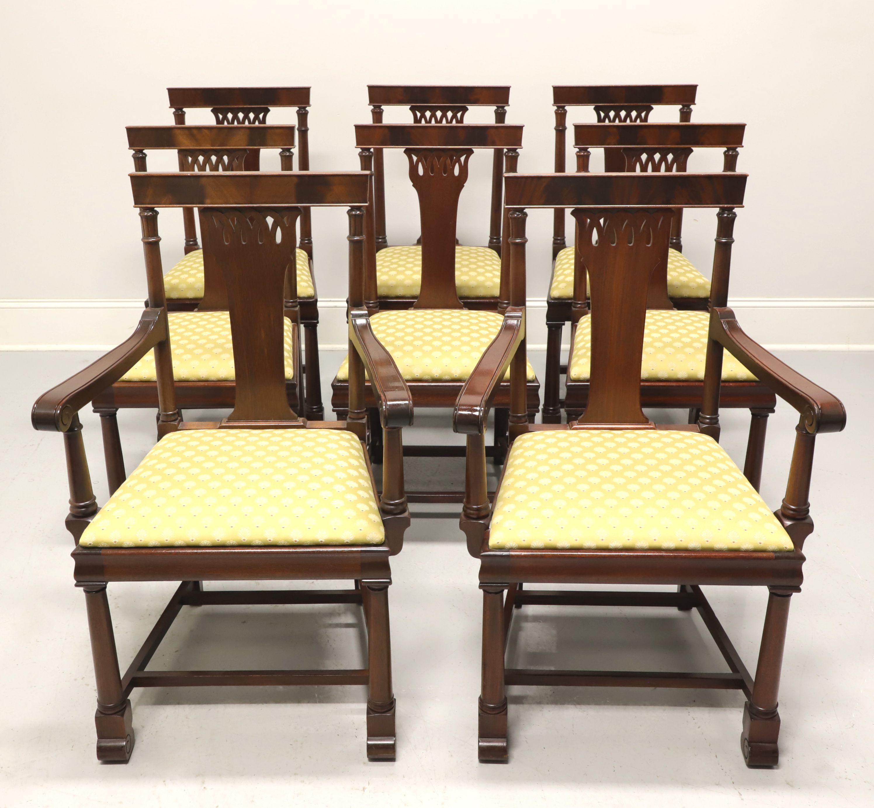 A set of eight 1940's era Empire style dining chairs, unbranded. Mahogany with flame mahogany barback crestrail, carved backrest, yellow gold color fabric upholstered seat, stretcher base, and doric column like seat back frame, arm supports & front
