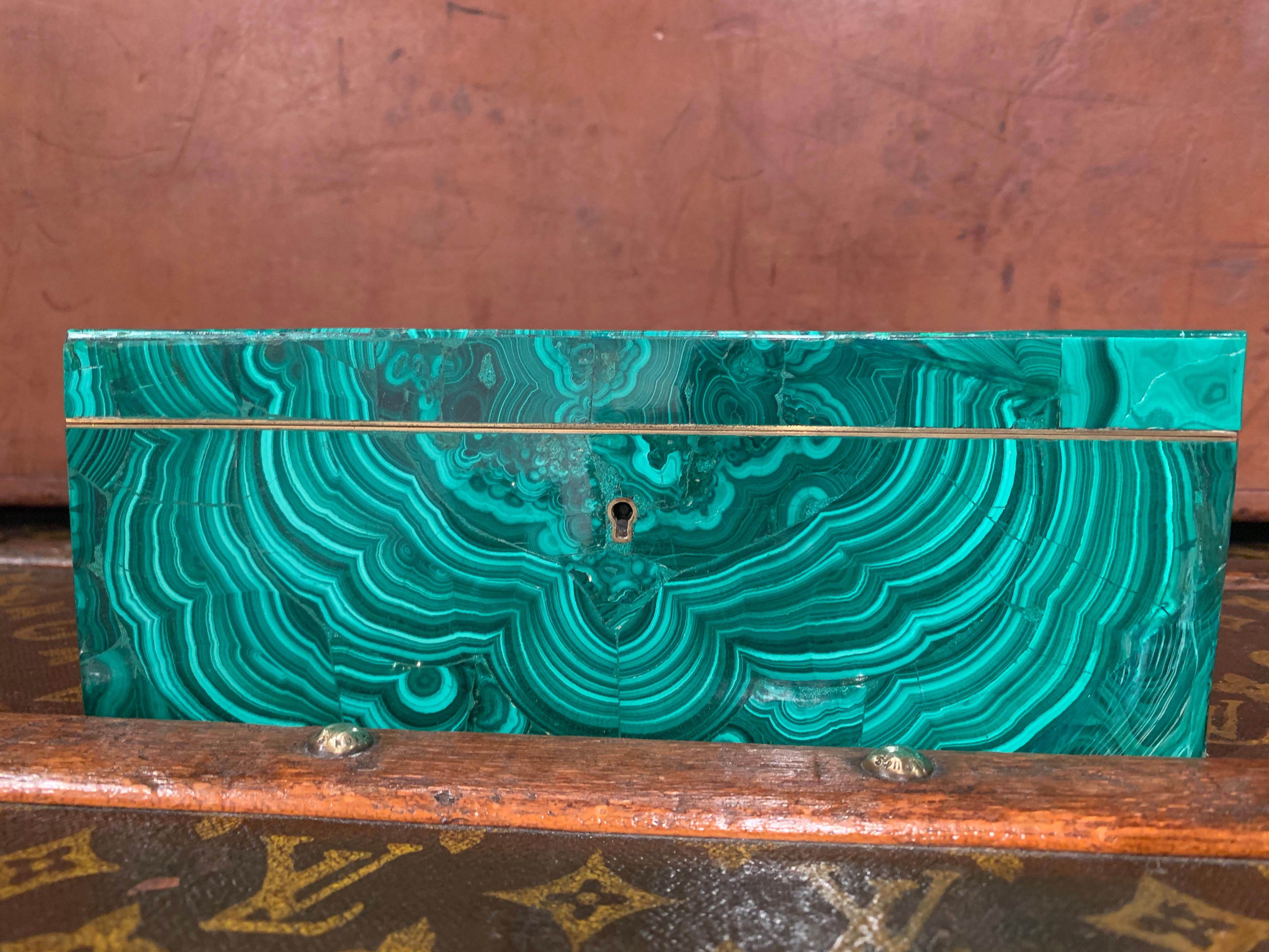 Box covered of Malachite stone on the exterior, and silk cushion on the inside with brass inside edges, the box can be locked by a key
The box was used as a jewelry box (the interior is original)
The Malachite has some cracks and slight tiny