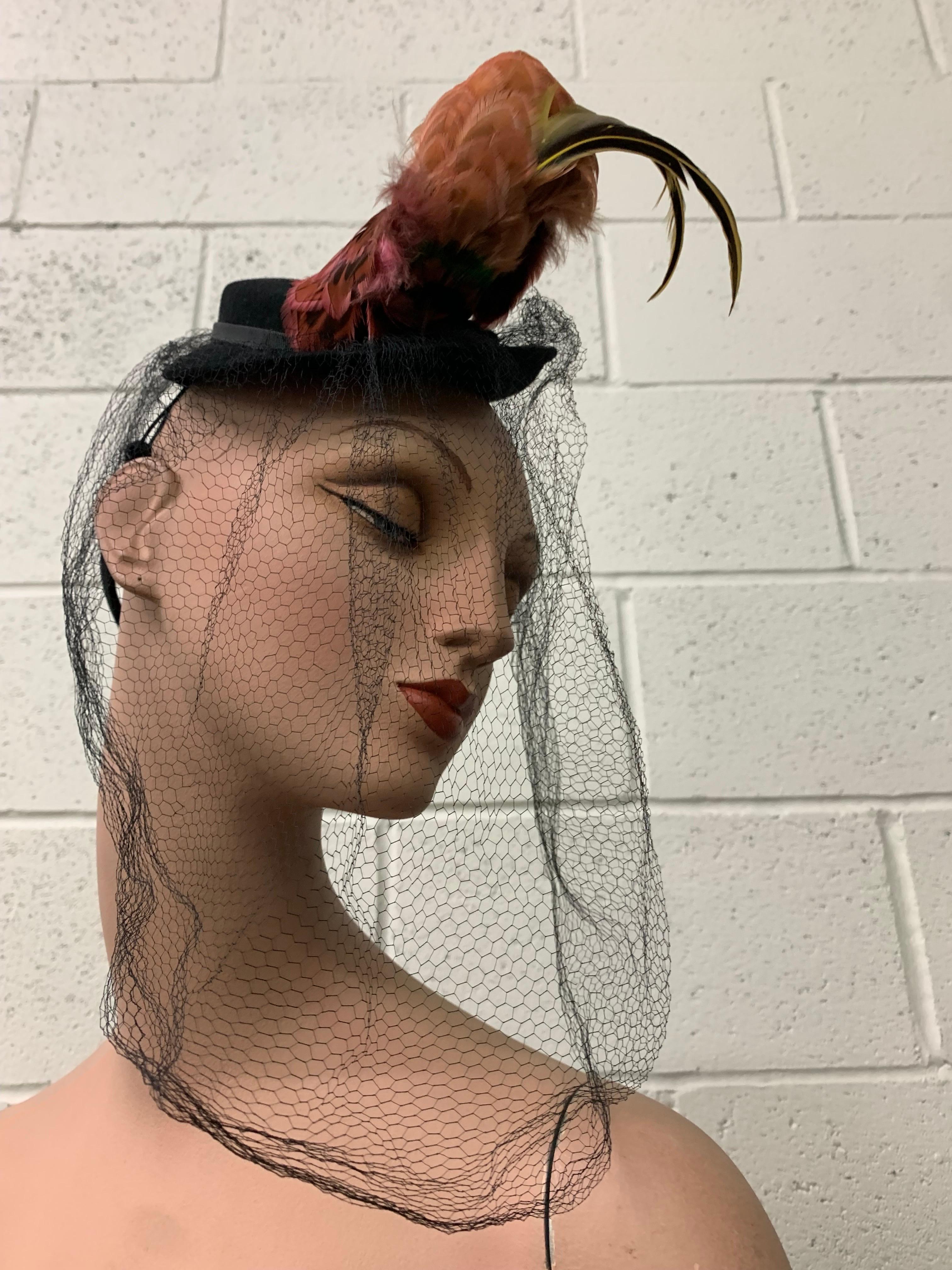 1940s Mathilde Model Black Felt Tilt Toy Hat w Exotic Feather Spray & Veil:  Feather detail is styled like a bird with an upright stance. Full black dramatic veil. Back of felt hat is paisley shaped for back interest. One Size Fits All. 