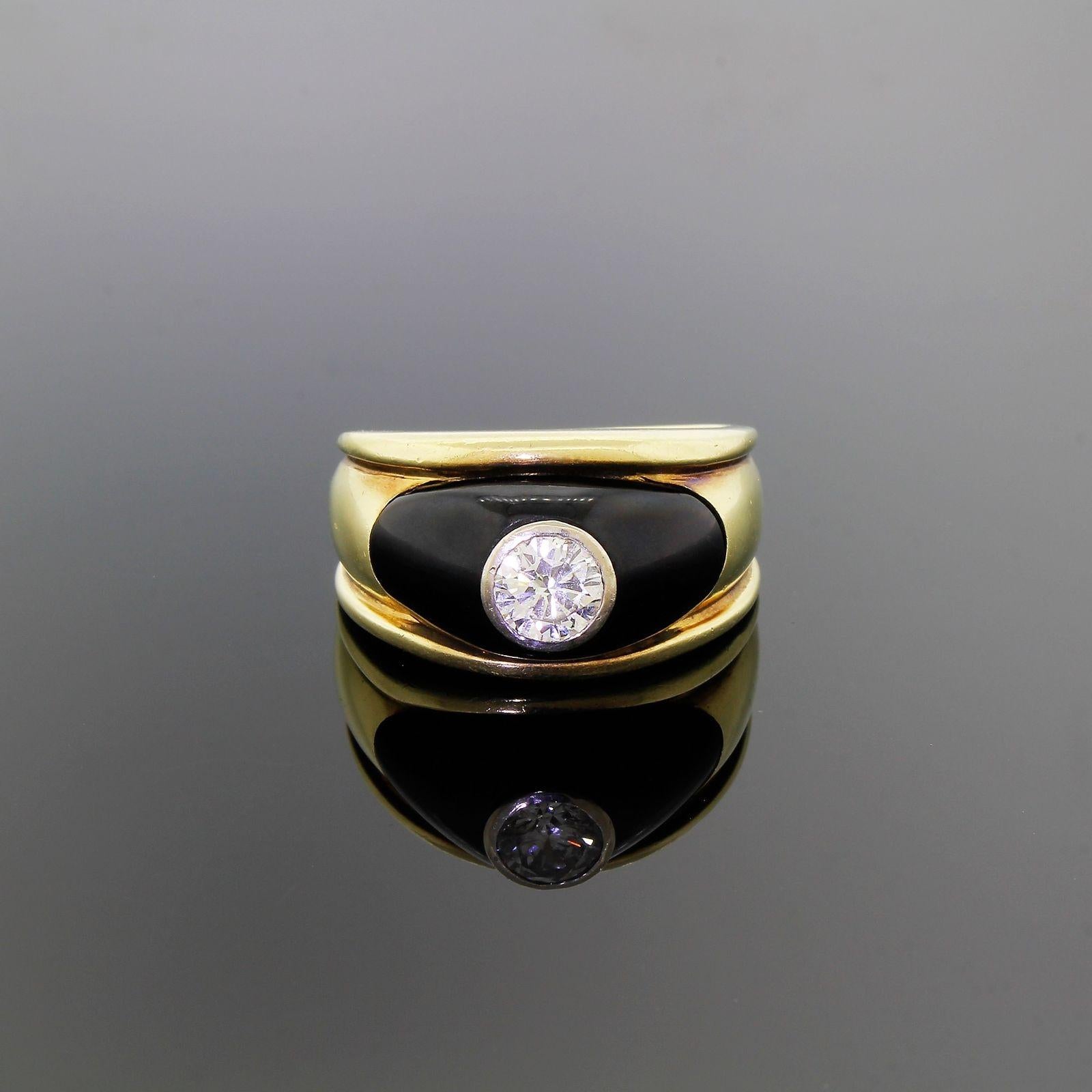Vintage Gentleman's 1940's Round Solitaire Ring in 14k Yellow Gold Mounting with Black Onyx accent.
Very substantial in both size and weight and looks amazing when worn a true classy not to mention timeless piece of jewelry.
The ring projects
