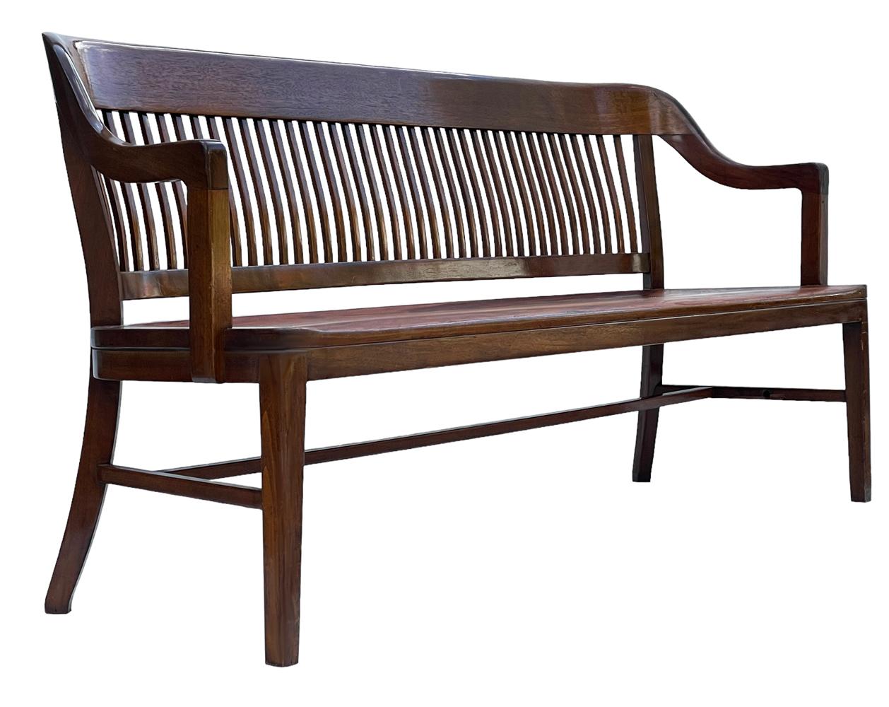 A classic solid bench from a Philadelphia Police station circa 1940's. It features solid dark stained oak construction. Very good ready to use condition. 