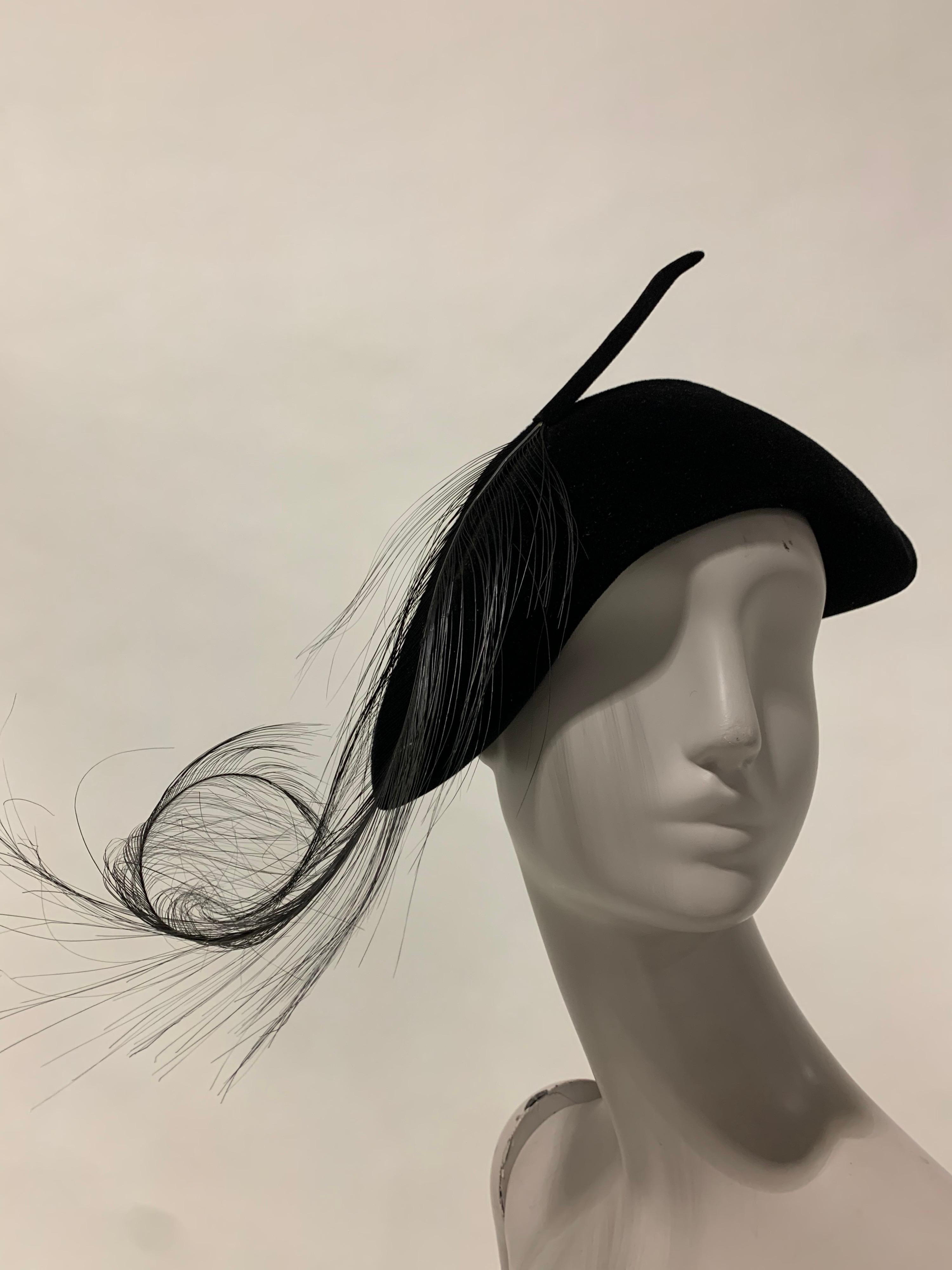1940s Milgrim Black Cashmere Felt French Style Hat with Singed Feathers. A dramatic Sally Milgrim design with the sculptural appeal of large curled and singed ostrich plumes and pure cashmere felt. Size up to 22.