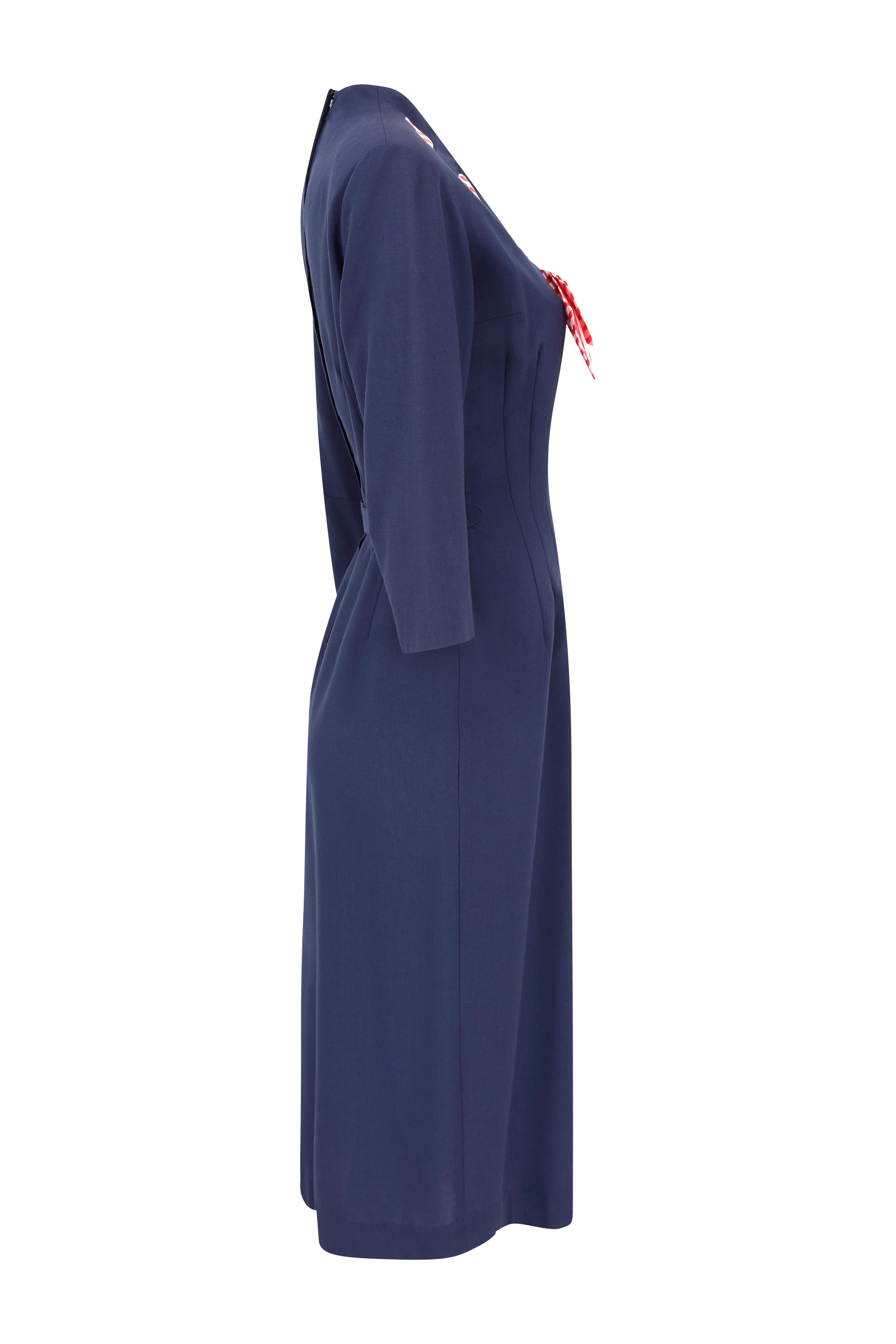 This sensational 1940s navy patriotic dress is incredibly rare and in absolutely impeccable vintage condition to the point that it is the best we have ever seen or are likely to see again. This piece will have been made around 1945-47 and the label,