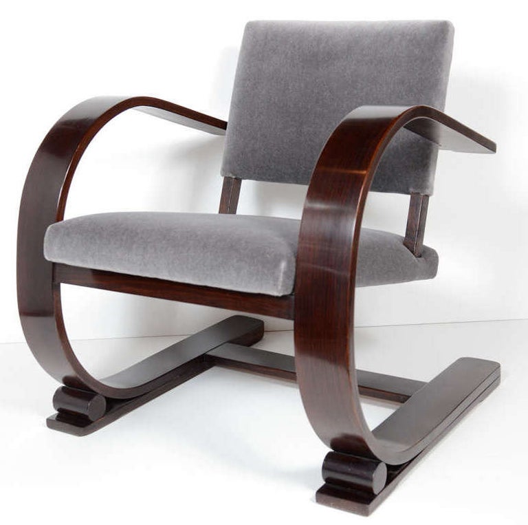 Exquisite bentwood lounge chair with Art Deco inspired design in brown mahogany wood. Newly upholstered in luxurious gunmetal mohair. Chairs have a flexible and slightly reclined frame, and are extremely comfortable. Truly beautiful from all angles.