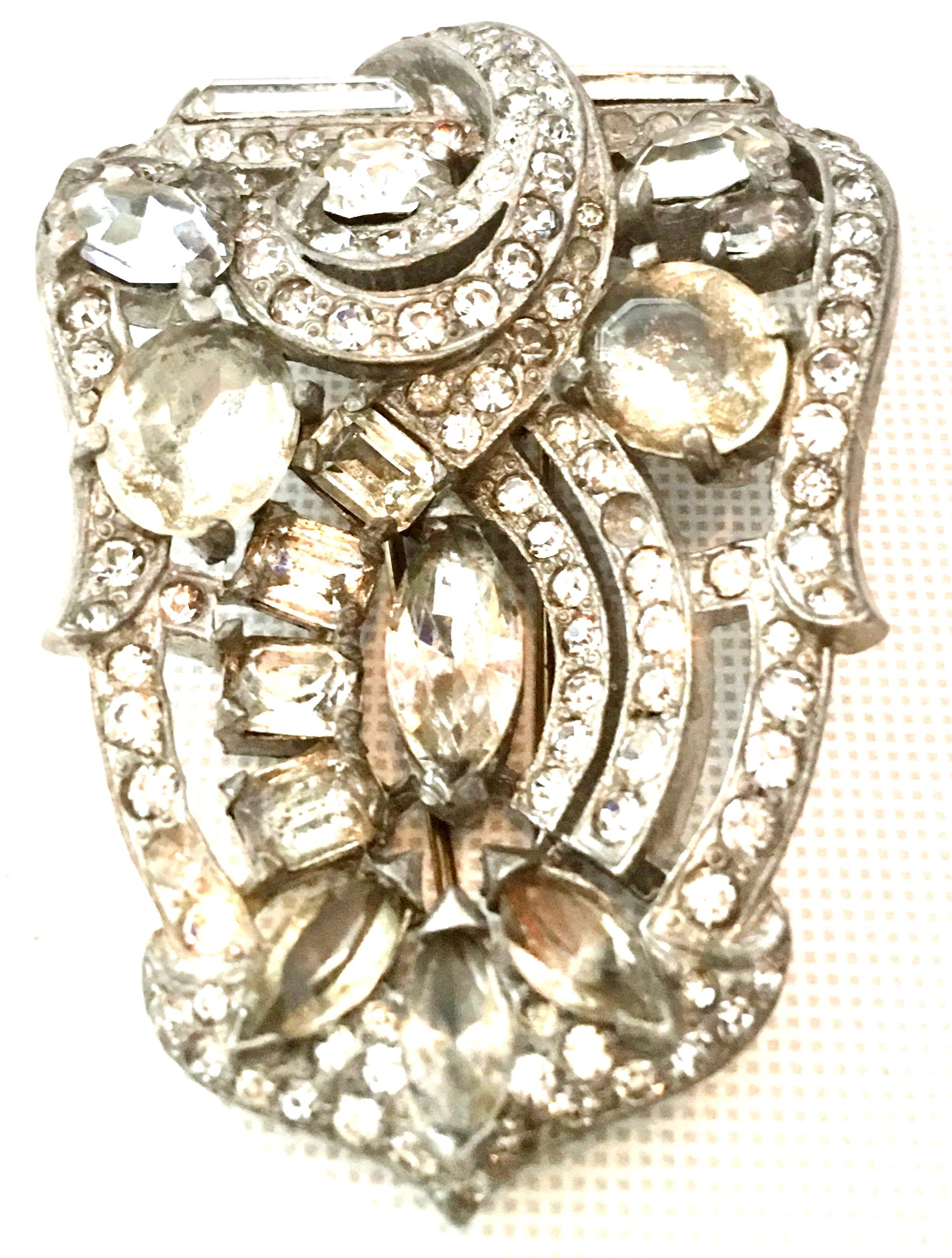  Mid-20th Century Monumental Coveted & Rare Silver Dimensional Swarovski Crystal Fur Clip By, Eisenberg Original. This finely crafted and signed piece features a silver plate base metal with Swarovski crystal bezel and prong set clear and darker