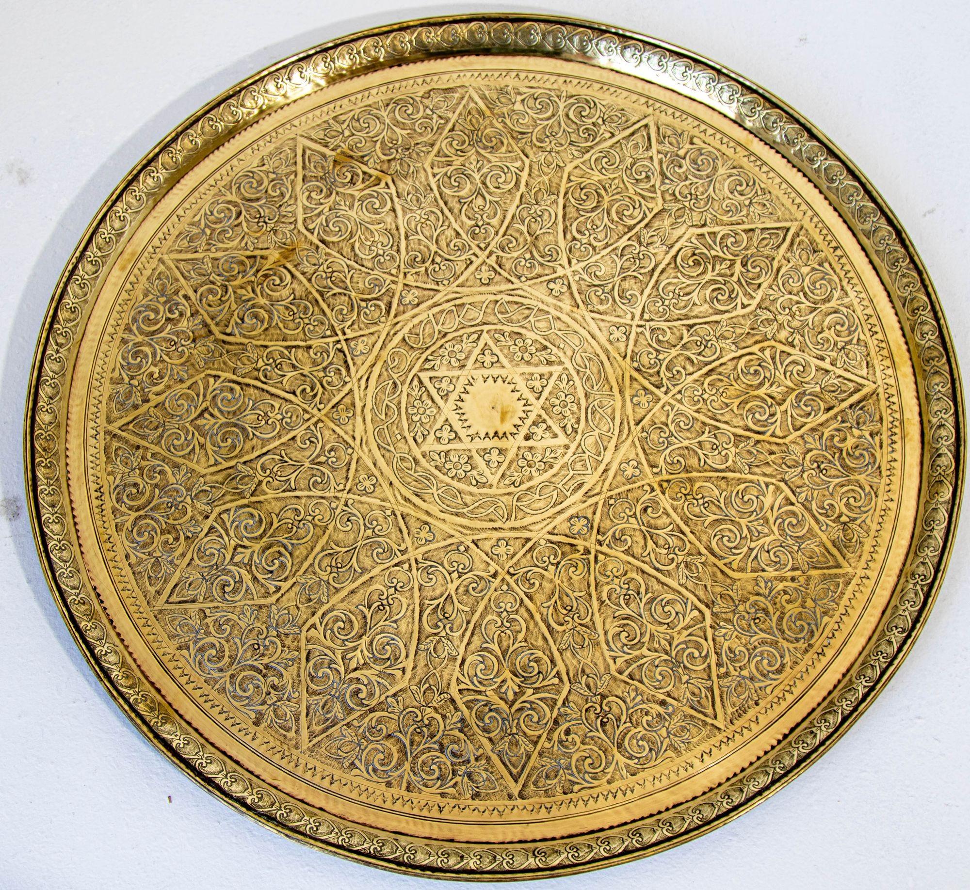A pished Moroccan brass tray is a stunning piece of traditional craftsmanship that showcases the rich artistic heritage of Morocco. It is meticously handcrafted by skilled artisans who specialize in metalwork and imbue each tray with intricate