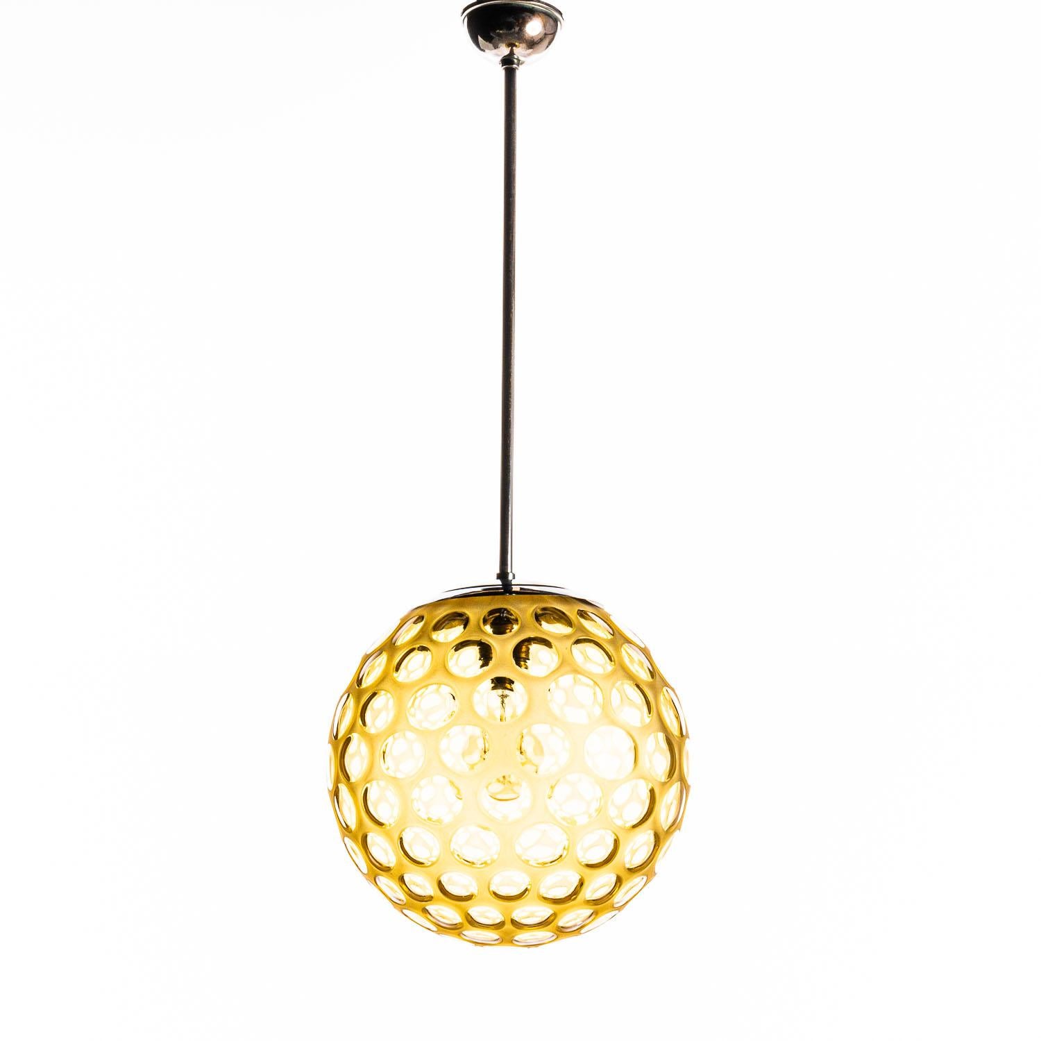 Fun Italian sphere pendant with a playful motif.