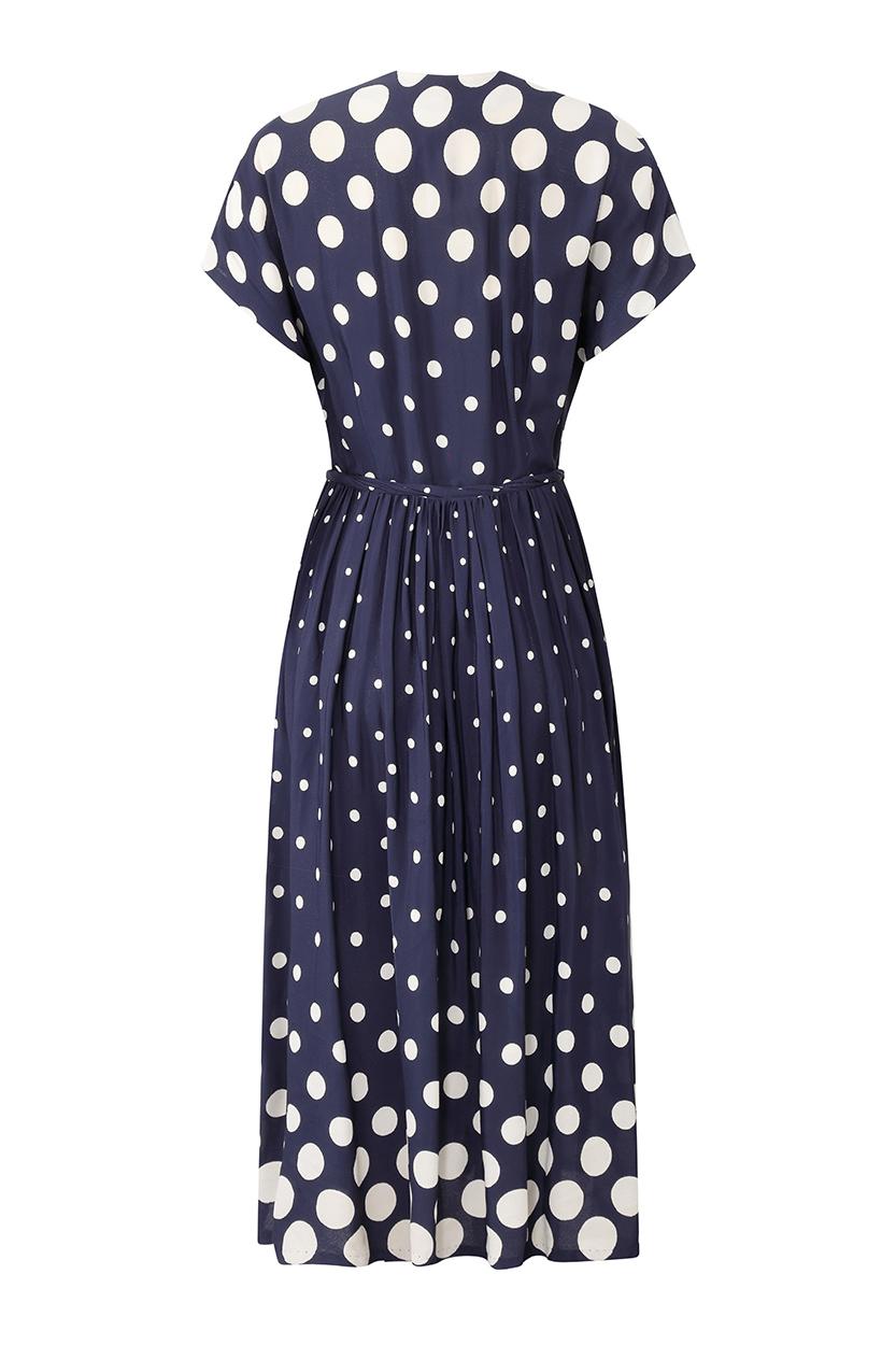 This lovely 1940s navy and white polkadot dress is in superb vintage condition for something of this age and is the perfect choice for an informal daytime event, easily accessorised to dress up for evening. The polkadot print varies in size with