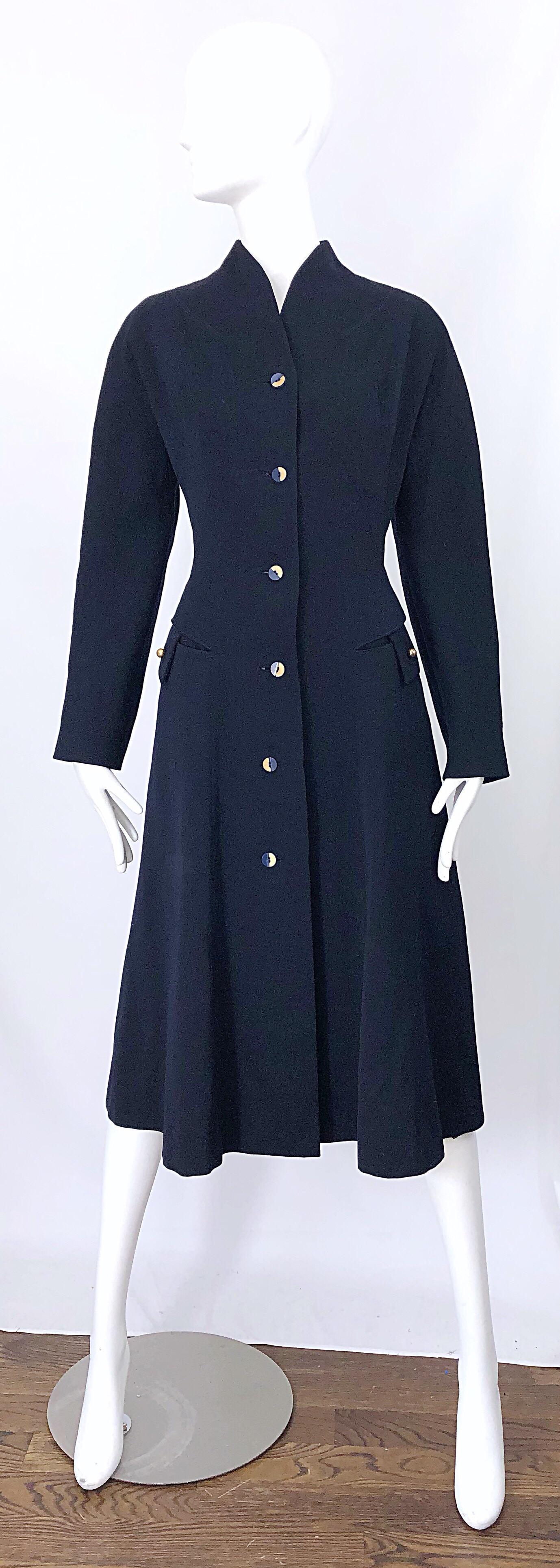 Sleek mid 1940s navy blue soft wool deco style jacket coat! Features a fitted bodice with a generous bottom. Royal blue and ivory color blocked buttons up the front, with small brass gold ball buttons at each pocket. Fully lined. Very well made with