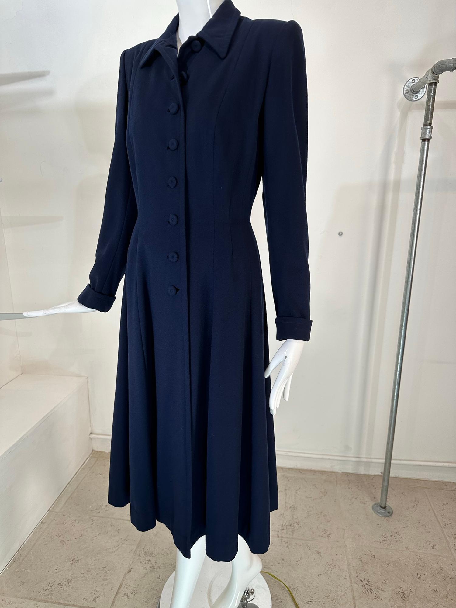 1940s navy blue wool princess coat, from Peterson Gerzog, Providence Rhode Island. A beautiful classic wool coat with amazing details such as, hand bound button holes, hand covered embroidered buttons at the front and on the turned back cuffs, the
