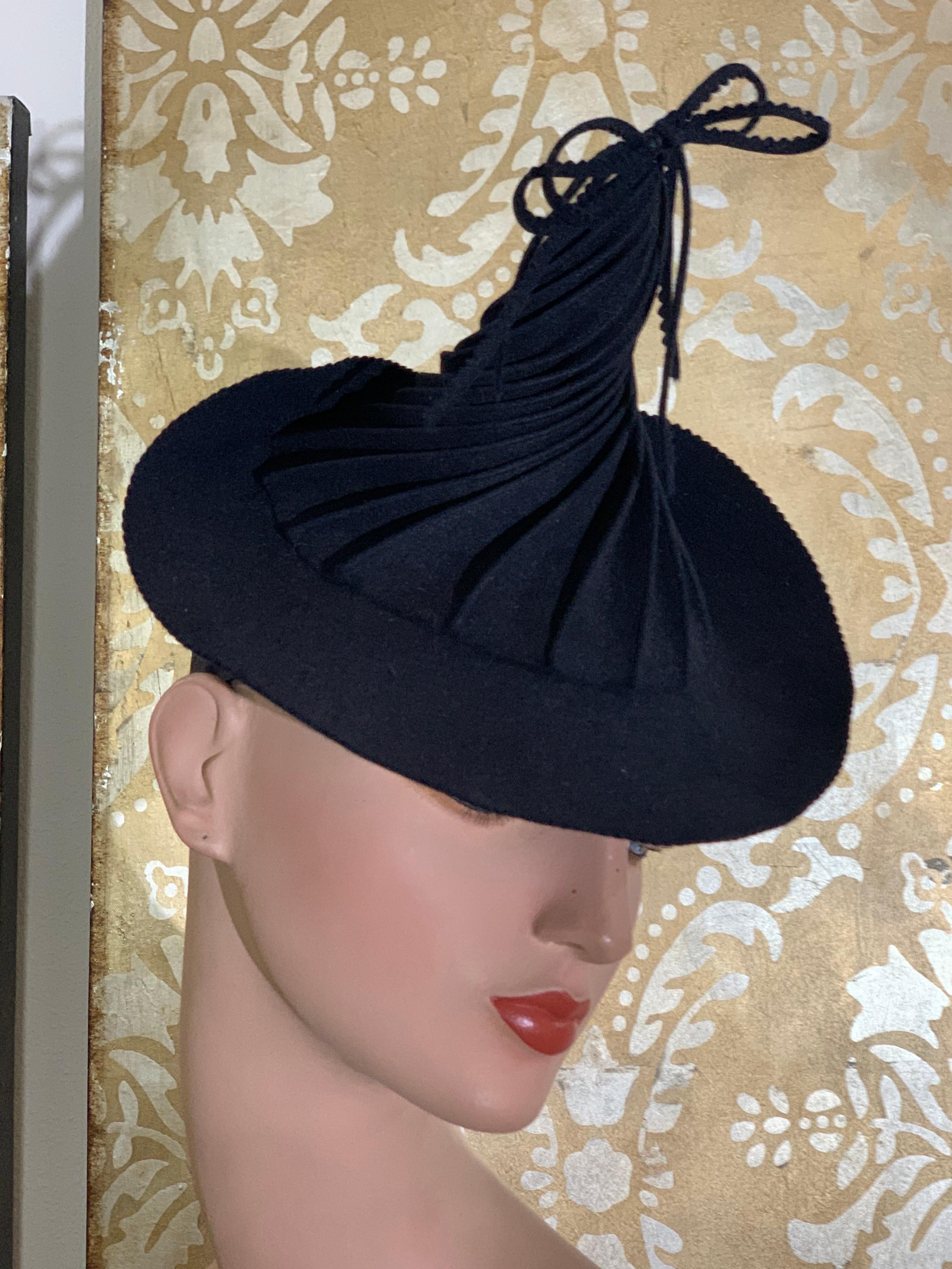 1940s Navy Unlabeled Hattie Carnegie Wool Peaked Spiral Toy Tilt Hat:  A whimsical statement piece in a gorgeous navy blue felt with a tall 6