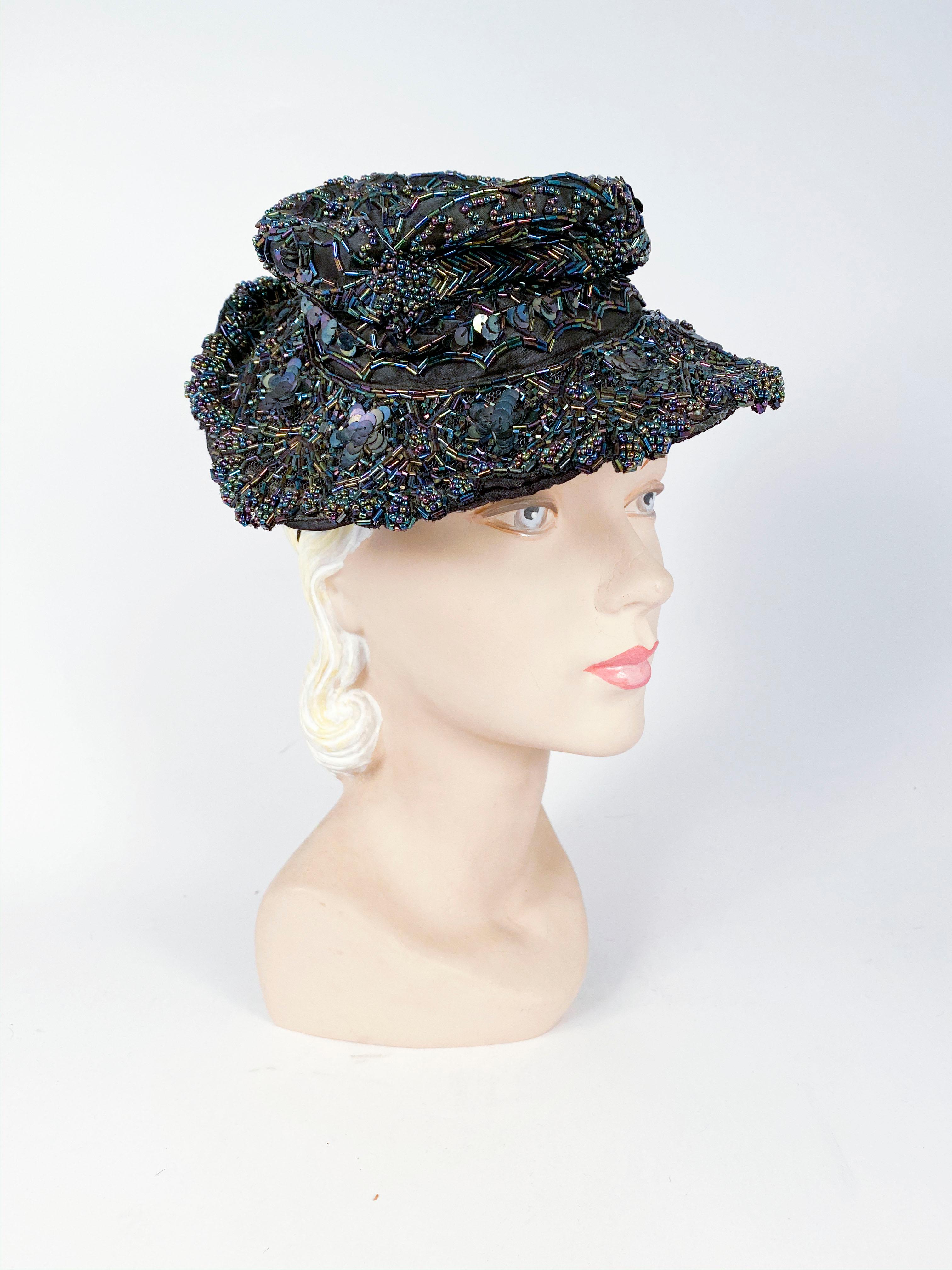 1940s Navy toy hat encased with navy iridescent beading and is to be worn perched on top of the head with the crown unstructured.