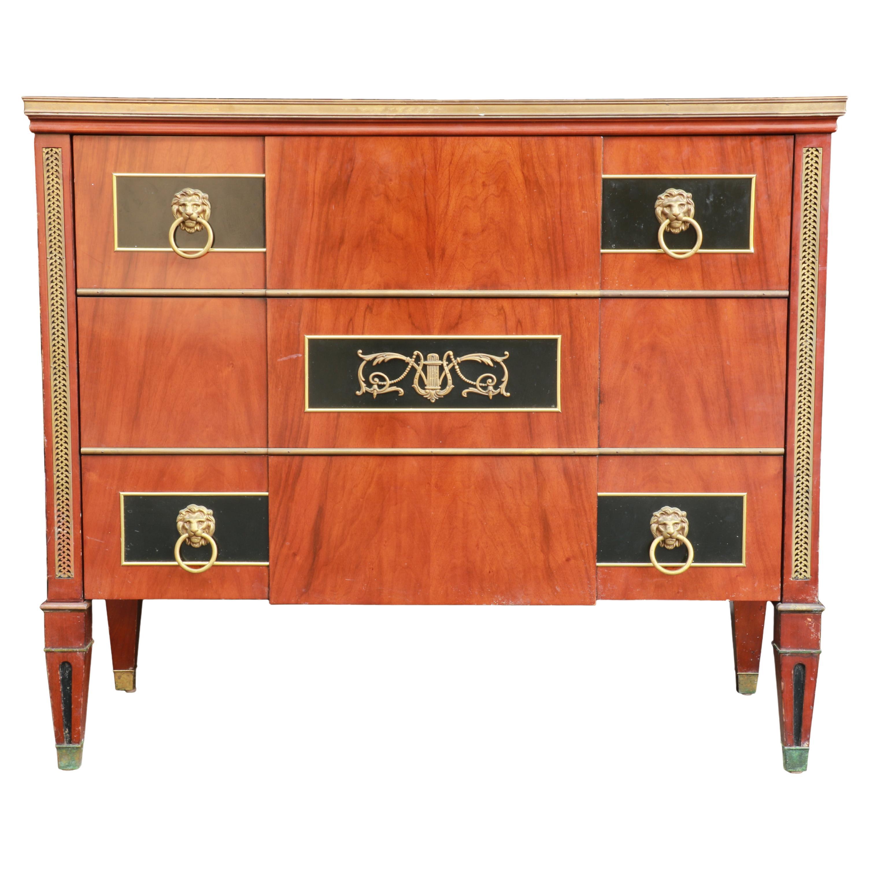 This is the most exciting, refined French style, neo classical chest of drawers by John Widdicomb with a marble top and three drawers. I am absolutely obsessed with the lion pulls, wood finish, drawer dovetail joinery and brass detailing. The chest