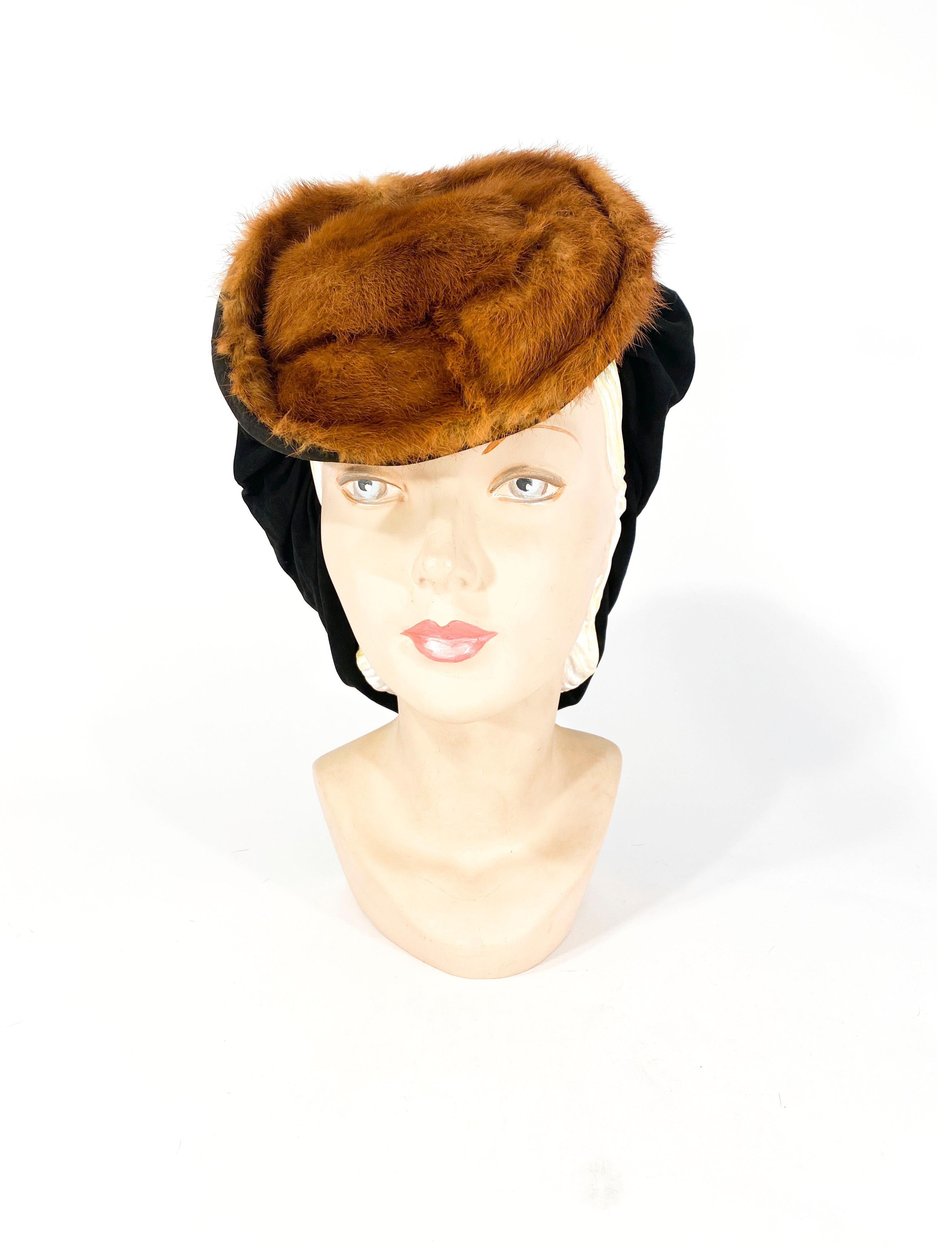 Late 1930s to Early 1940s red nutria fur hat with black leather suede stood on the back. 